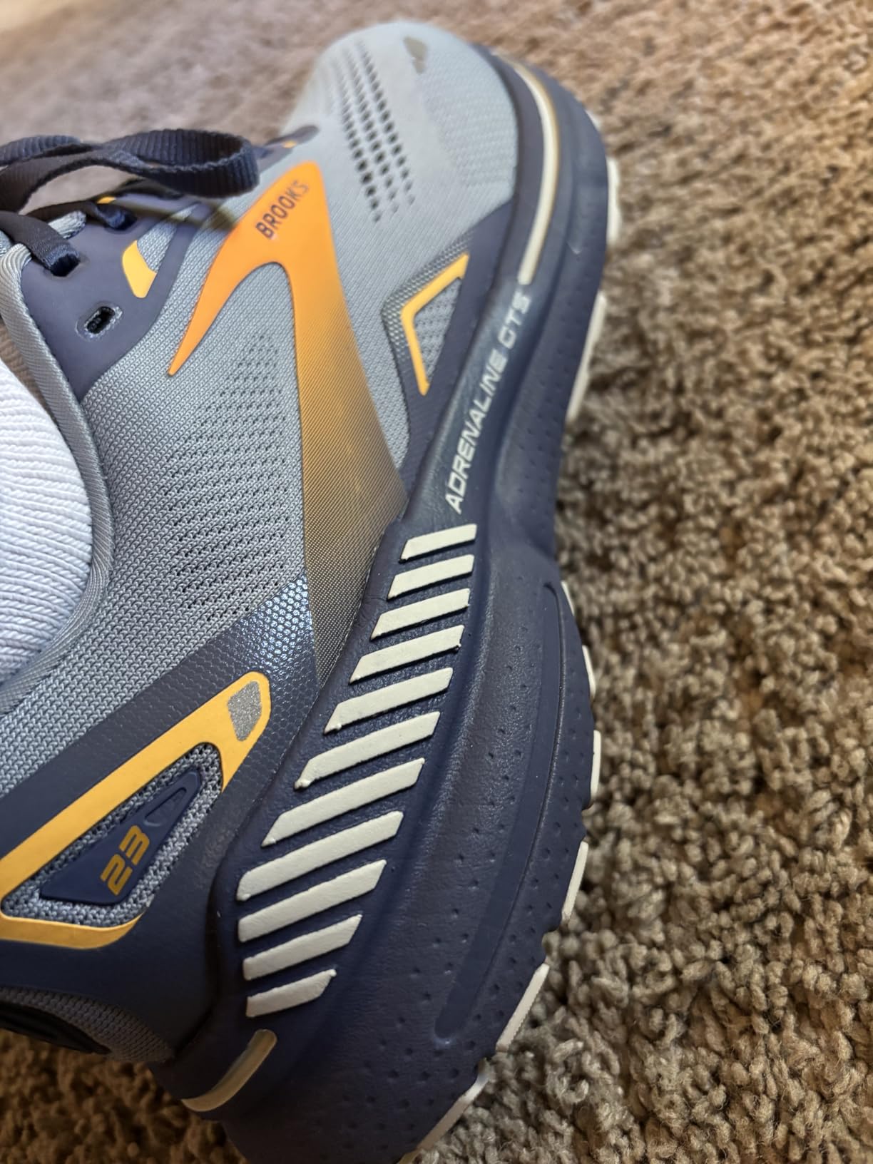 Brooks Adrenaline GTS 23 side view showing engineered mesh upper and midsole design details