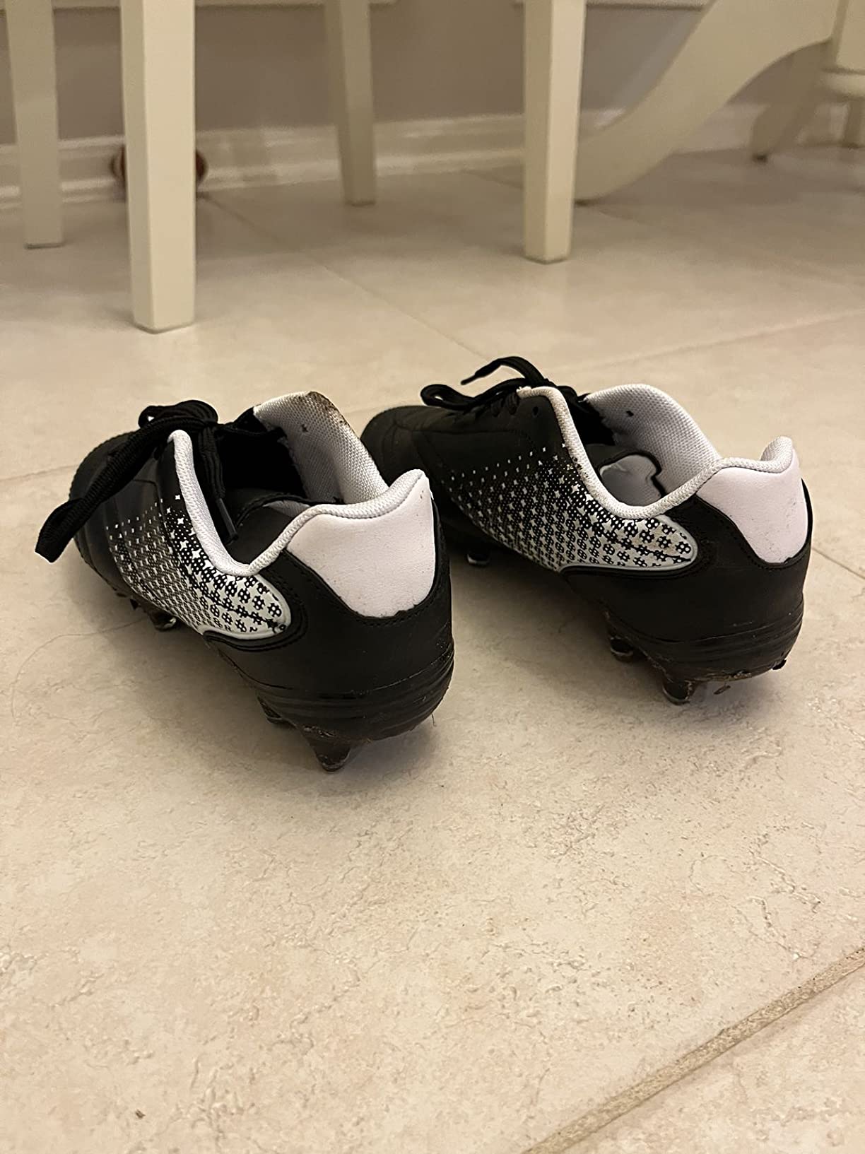 LIZRHA kids soccer cleats side view showing profile and cleat pattern on artificial turf
