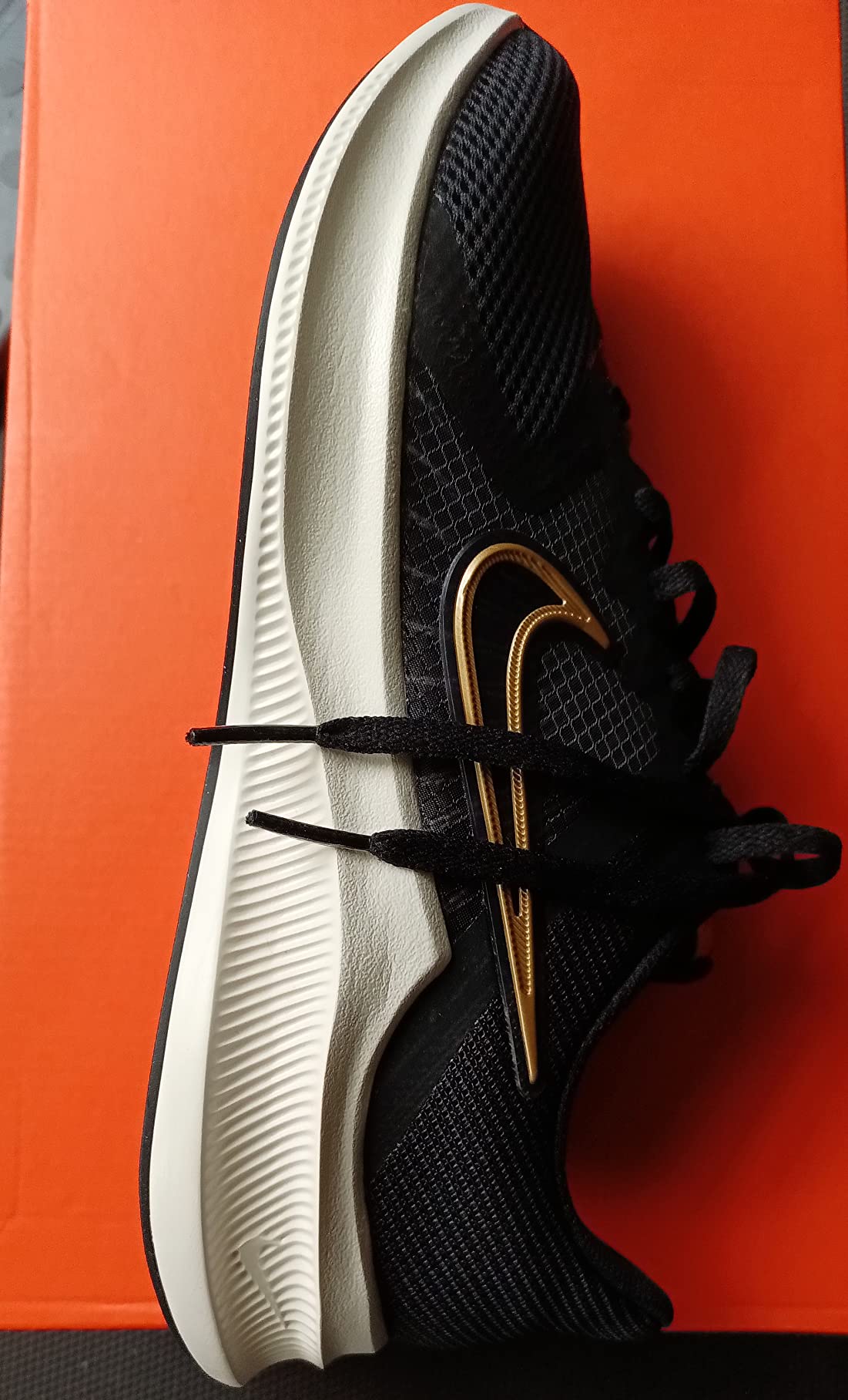 Nike Men's Stroke Running Shoe in action showing runner's feet during training session