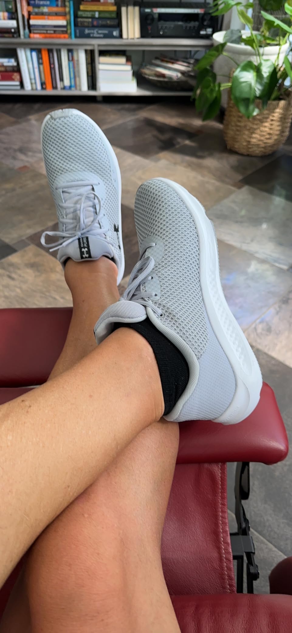 Under Armour Charged Pursuit 3 showing outsole traction pattern and flex grooves