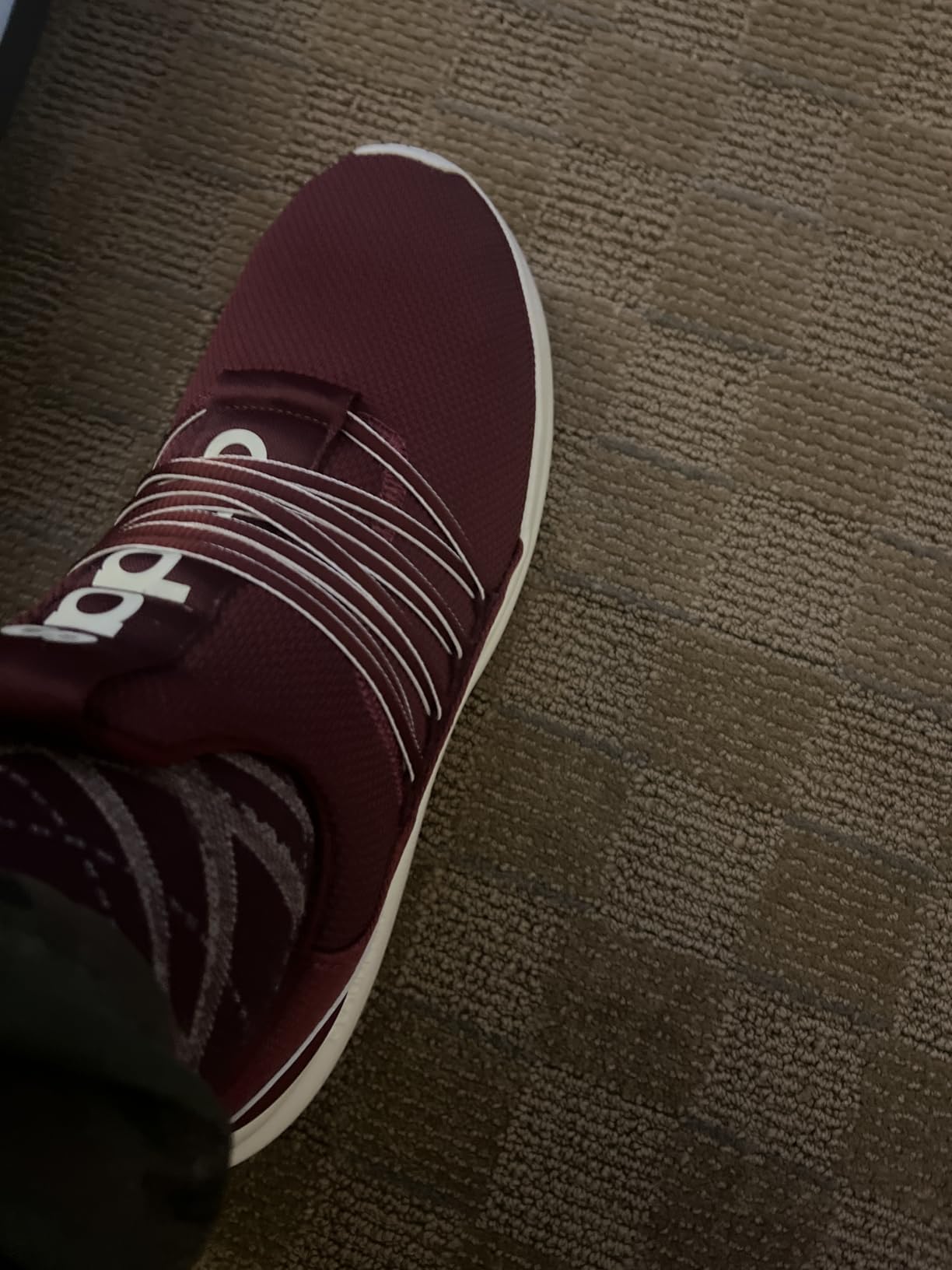 Side view of Adidas Lite Racer Adapt 7.0 showing profile and Cloudfoam midsole construction