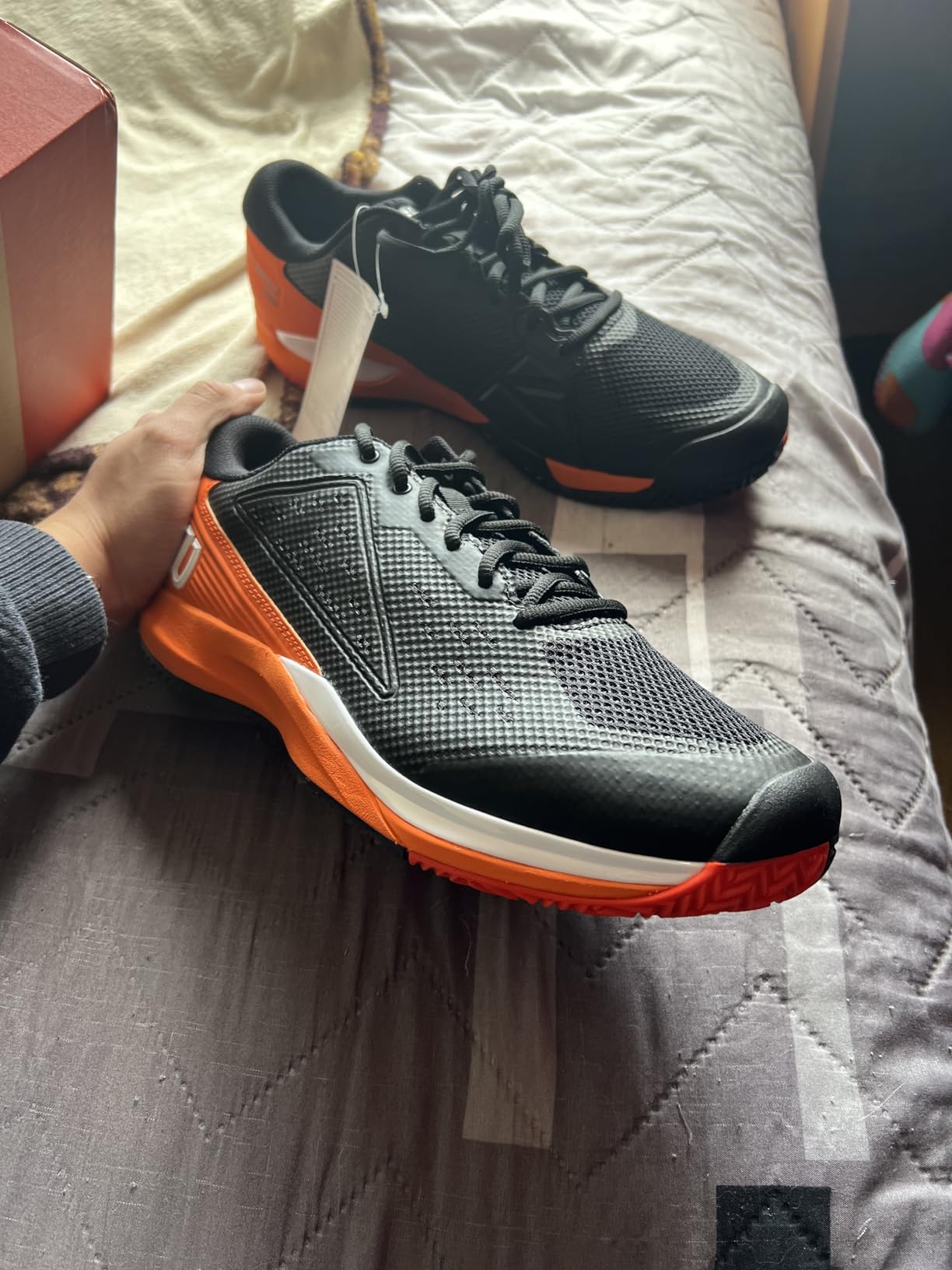 Wilson Rush Pro Ace tennis shoe side profile showing Sensifeel upper construction and 4D chassis technology