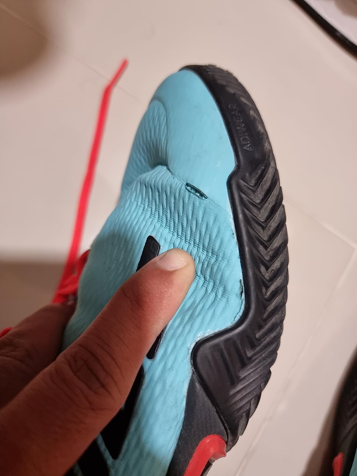 Detailed view of Adidas Barricade construction showing material quality and wear patterns