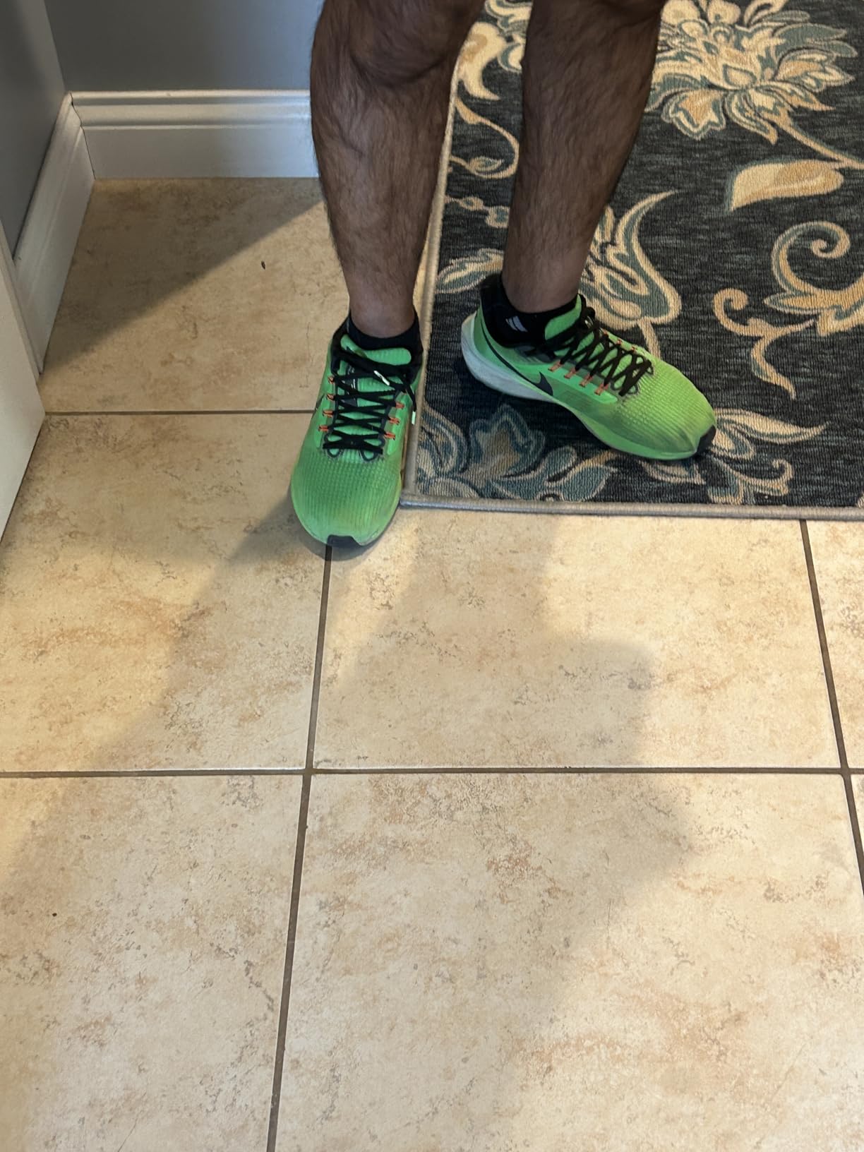 Nike Pegasus 39 in bright lime green colorway showing style options available