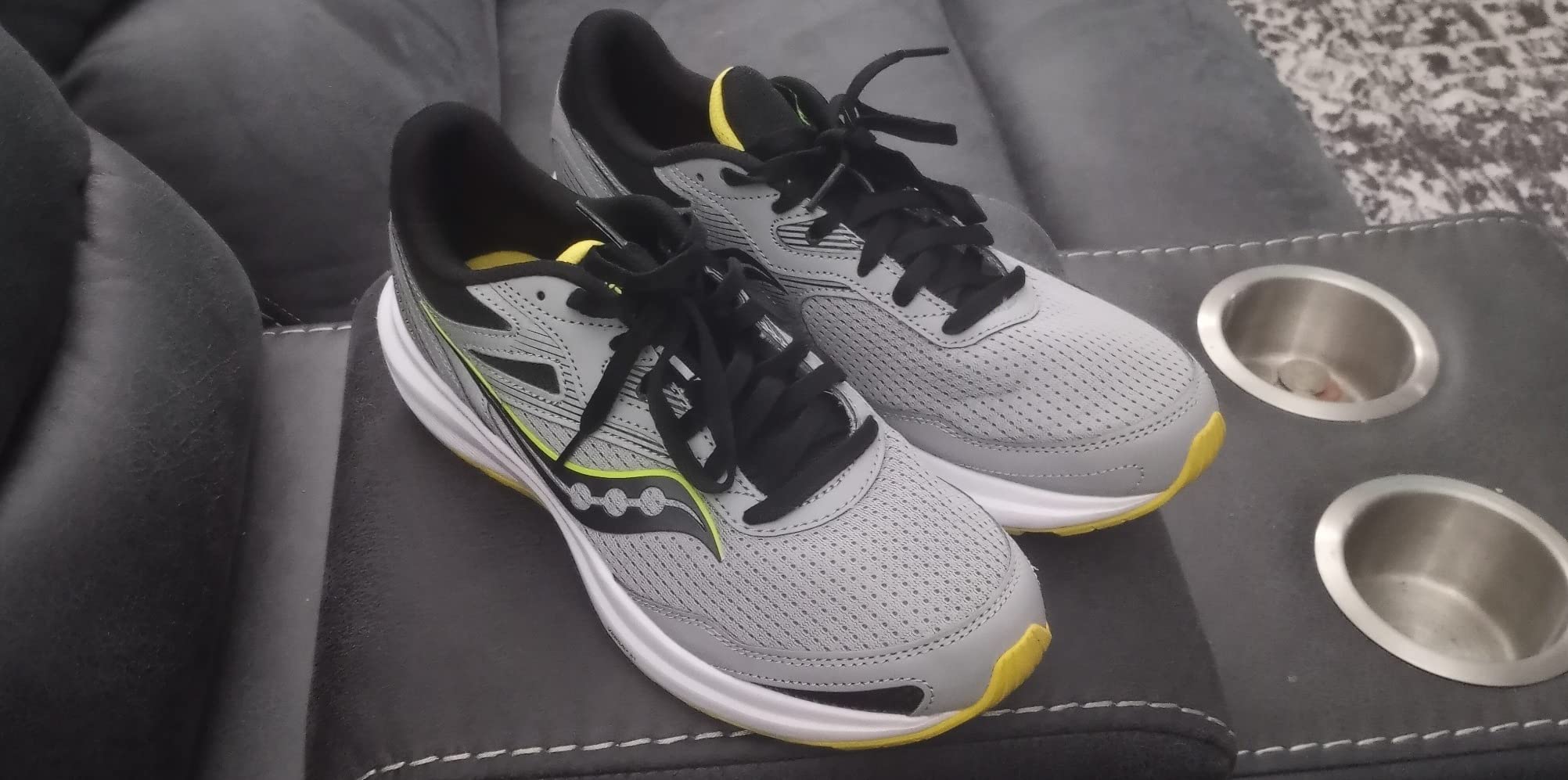 Saucony Cohesion 16 in action during outdoor running showing real-world usage scenario