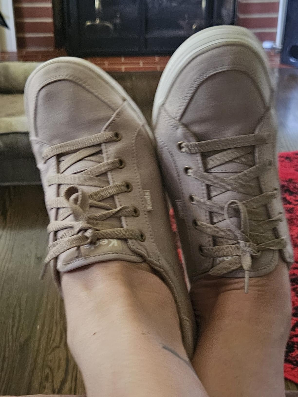Keds sneakers being worn with jeans showing versatile casual styling