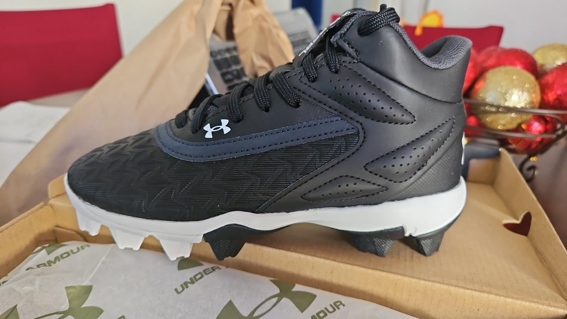 Under Armour Boys Leadoff Mid baseball cleats red colorway side profile showing EVA midsole and mid-top ankle support