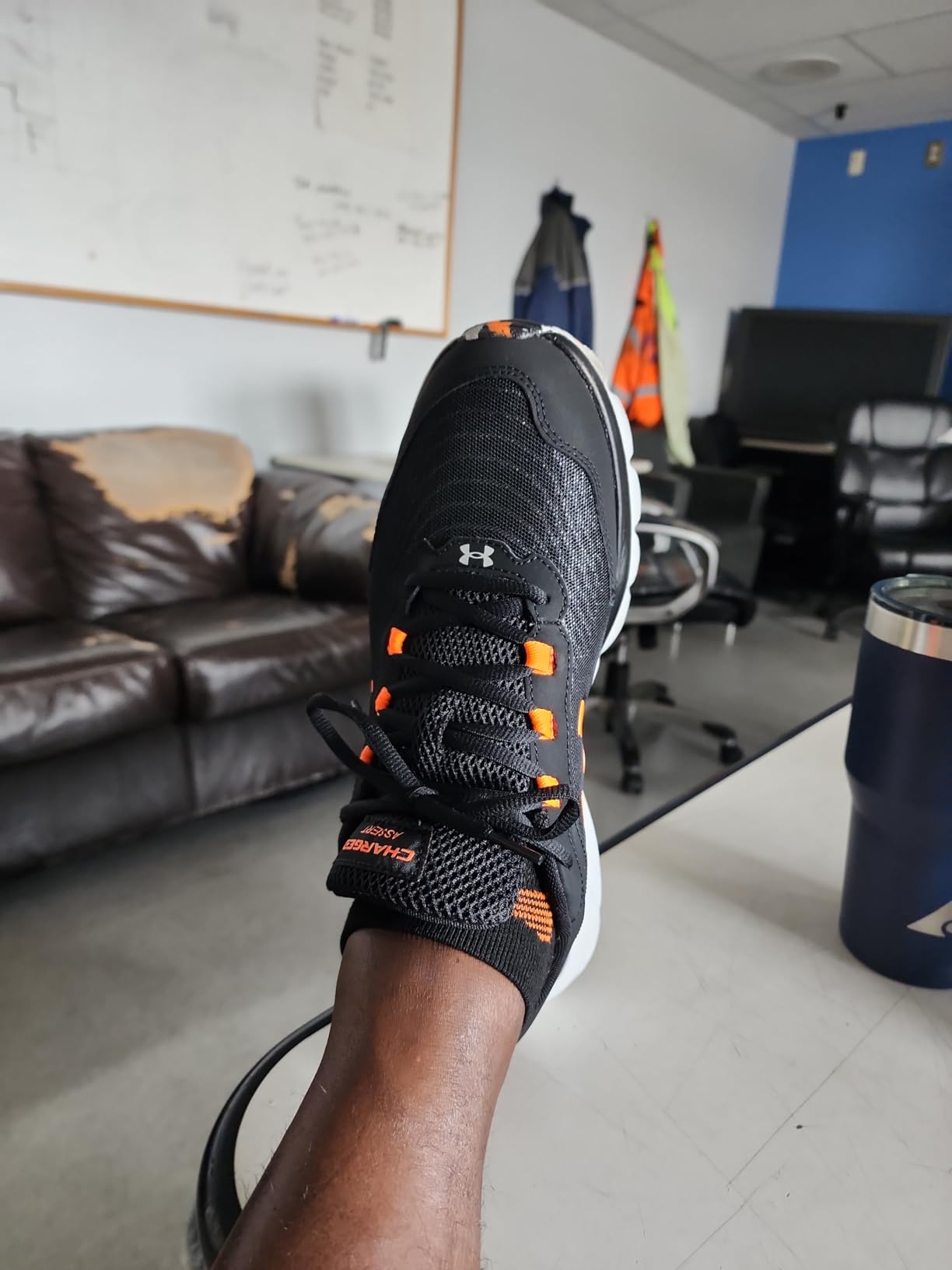Under Armour Charged Assert 9 side profile highlighting Charged Cushioning midsole technology and 10mm heel drop