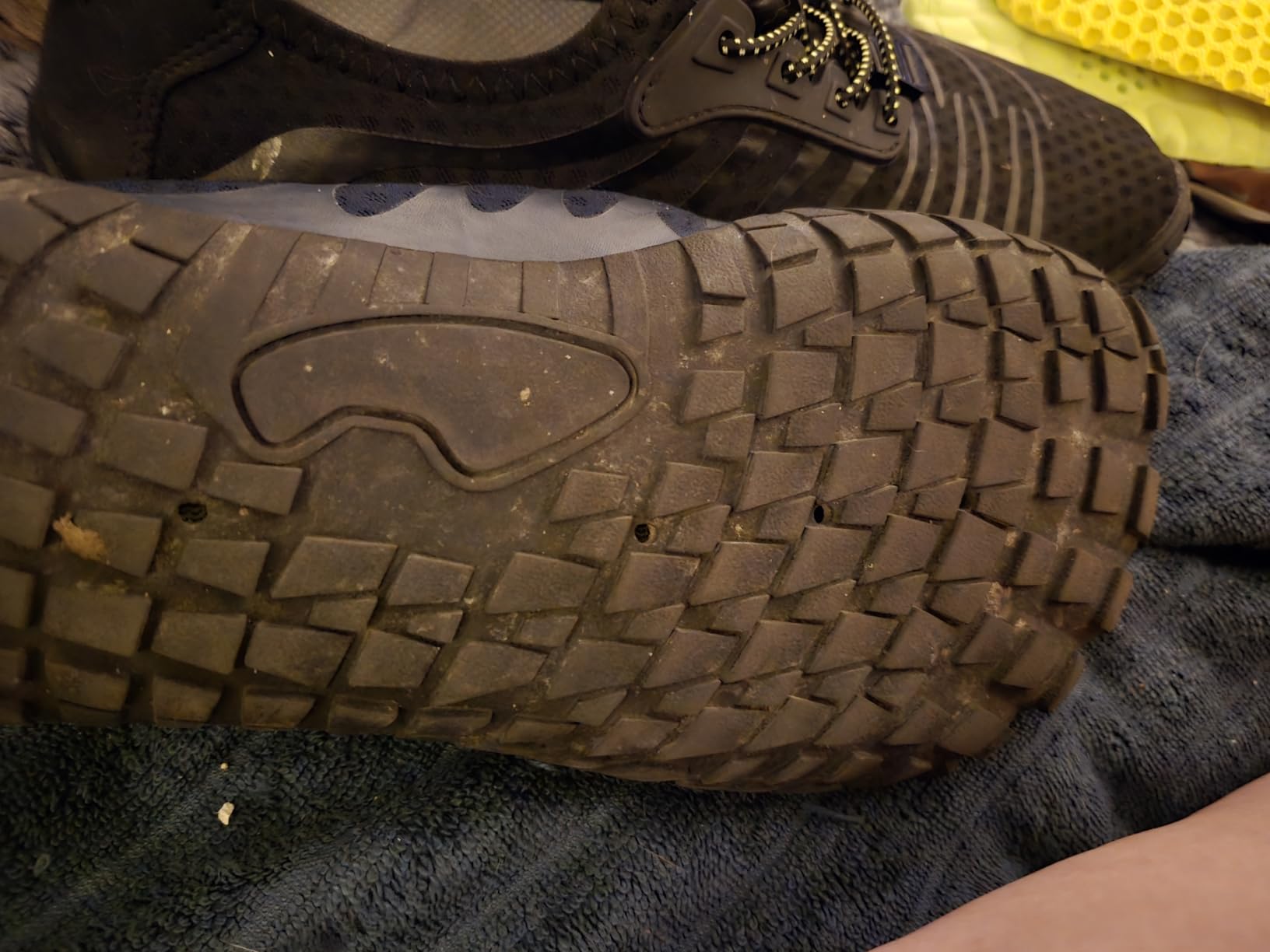 Close-up of mesh upper material showing breathable construction and elastic lacing system