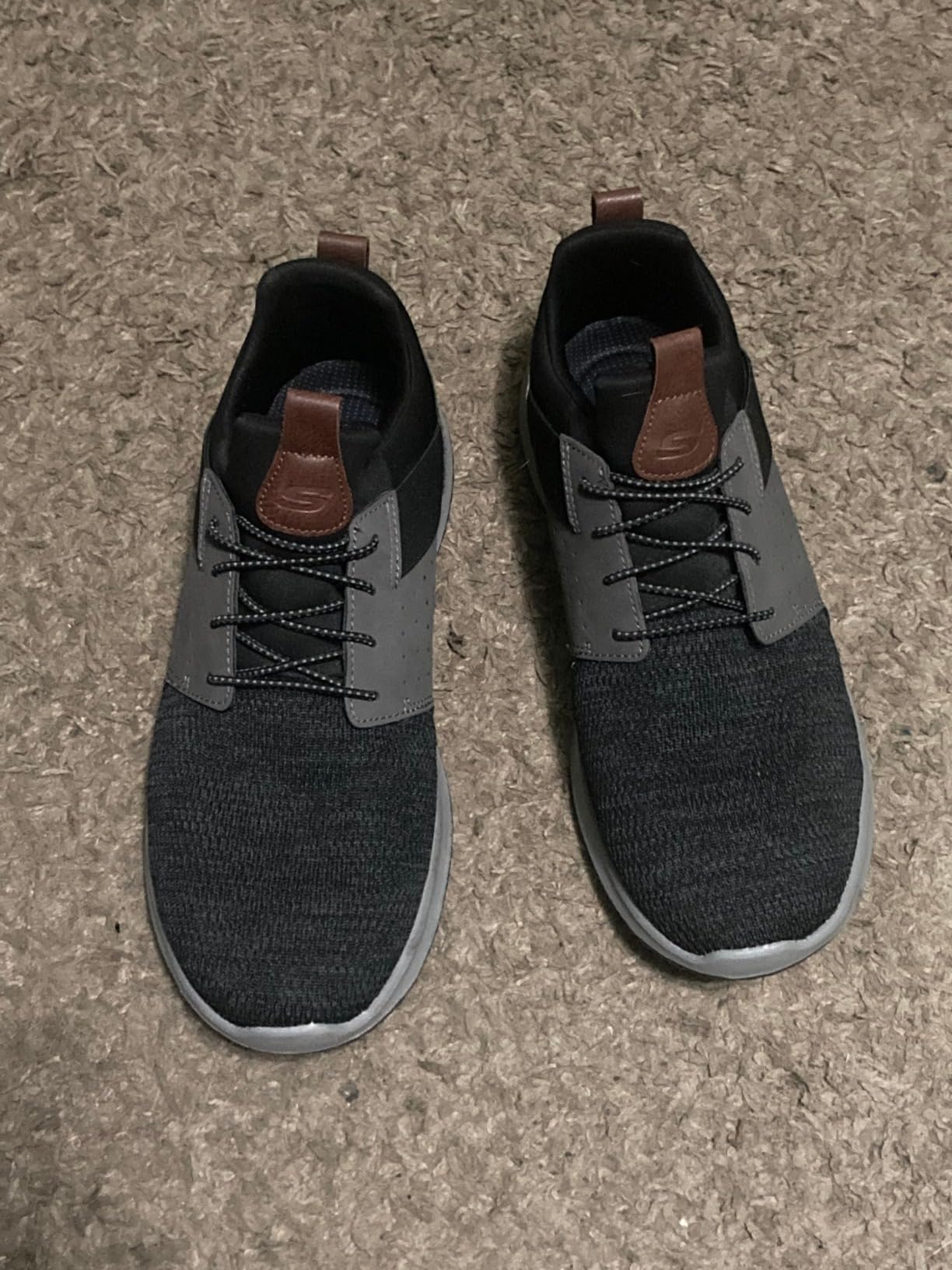 Skechers Men's Classic Fit Delson-Camden Sneaker showing black and gray colorway with slip-on design and mesh upper