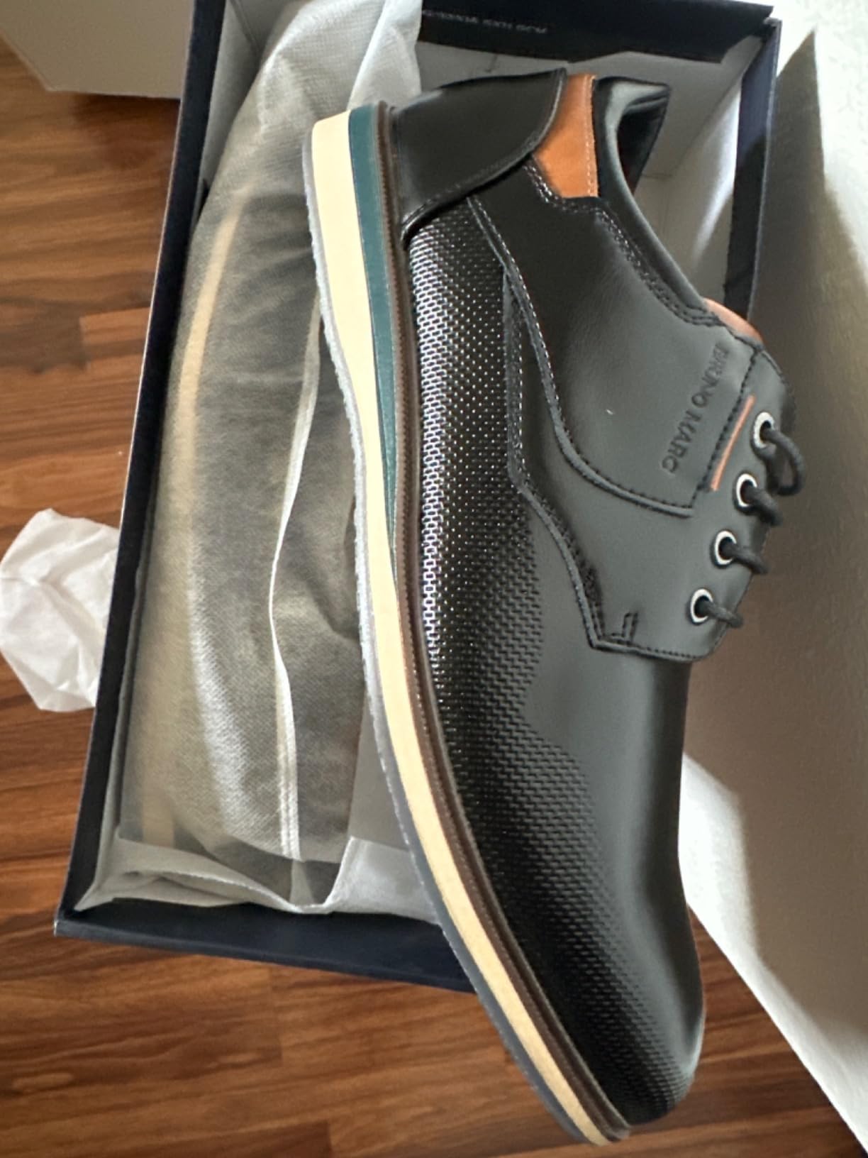 Side profile of Bruno Marc dress shoe showing the lace-up closure and overall silhouette