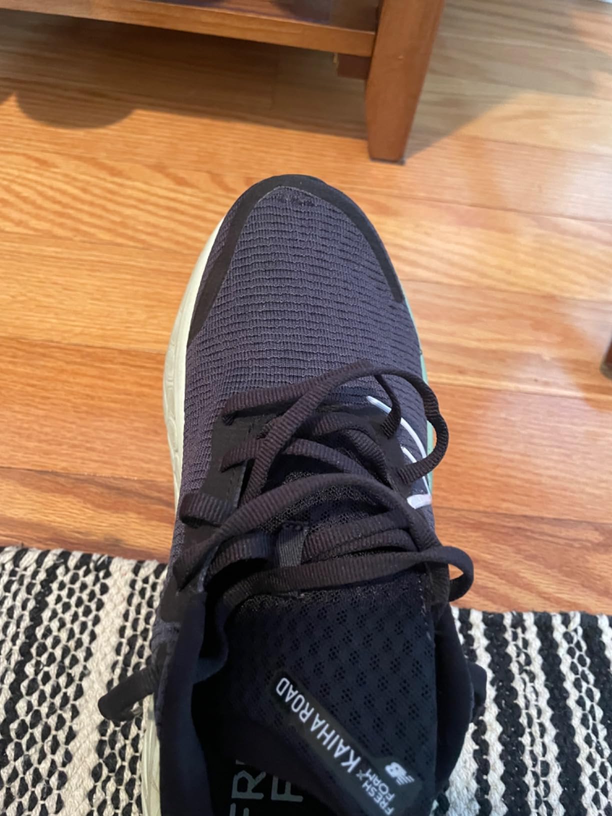 Close-up showing mesh durability issues with small holes appearing in the toe area after regular use