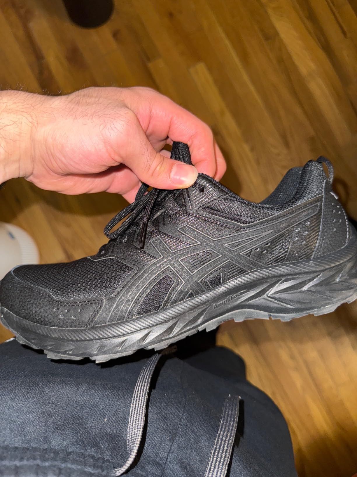 Close-up of ASICS Gel-Venture 9 mesh upper construction and lacing system detail