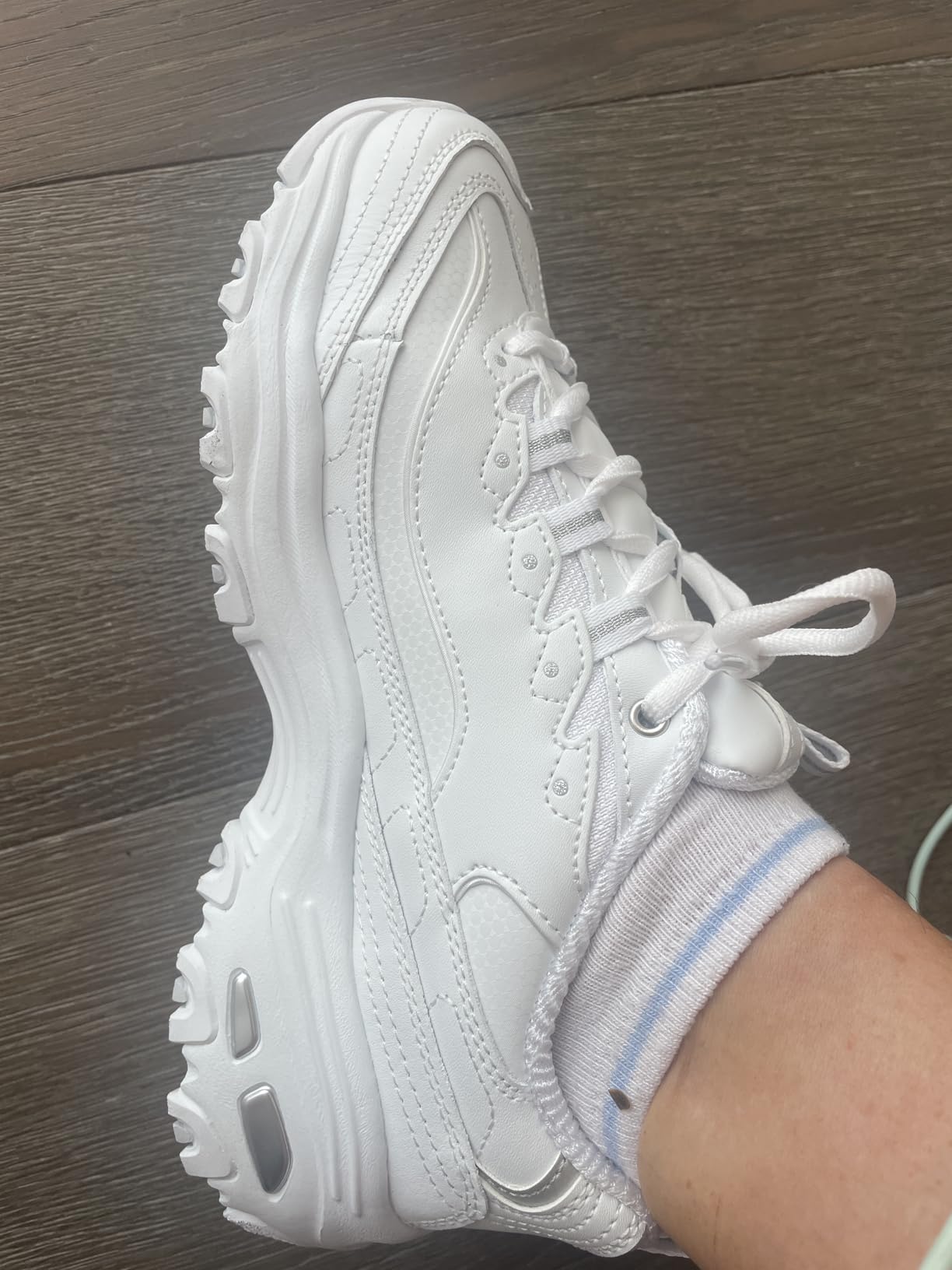 Skechers D'Lites product shot highlighting memory foam and comfort features