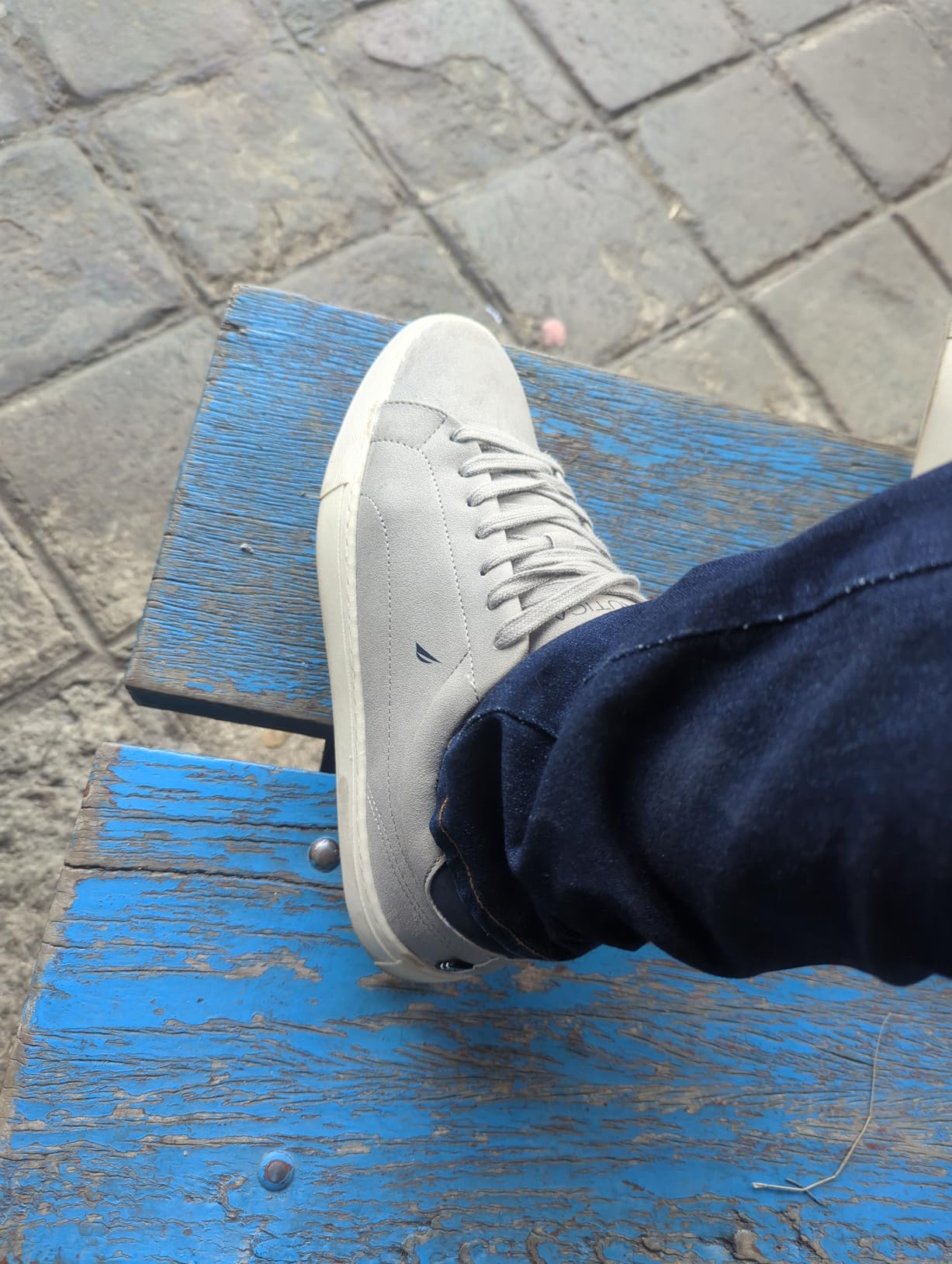 Nautica boat shoes detail shot showing faux suede upper and lace-up closure system