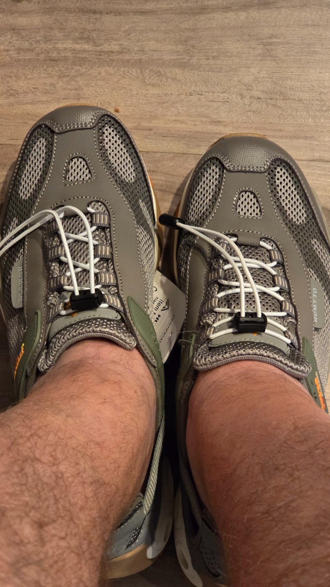 Close-up of HUMTTO rubber sole showing deep tread pattern and side drainage holes