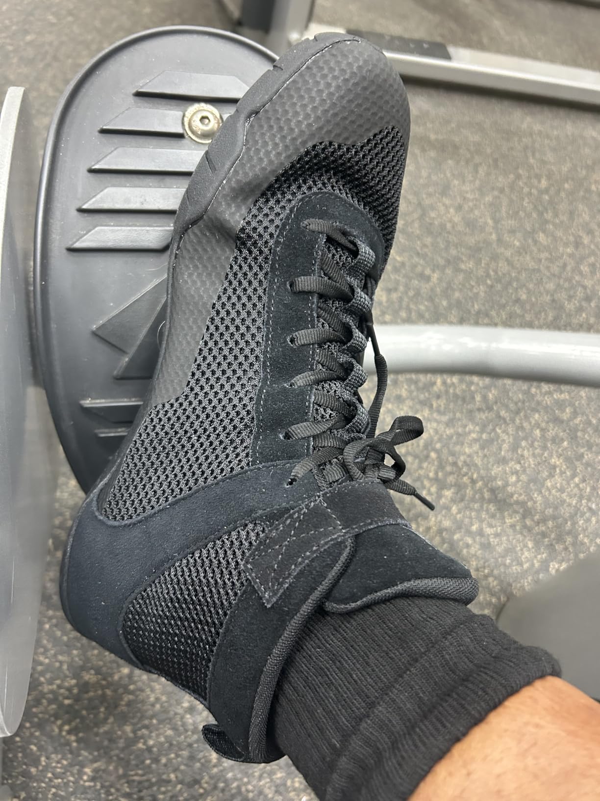 Wrestling shoes during training session showing grip and stability on wrestling mat surface