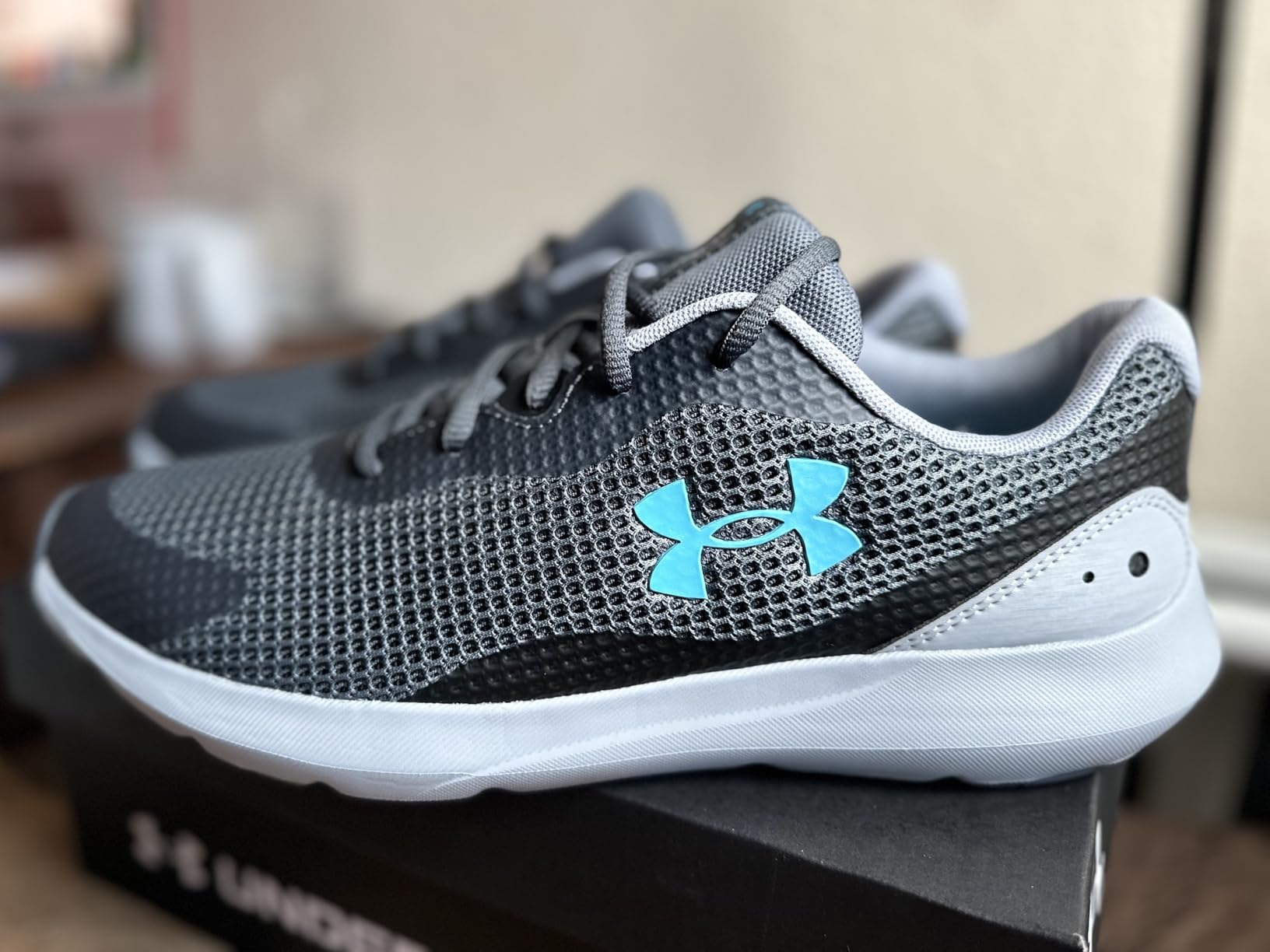 Under Armour Surge 3 side profile showing mesh upper construction and rubber outsole pattern
