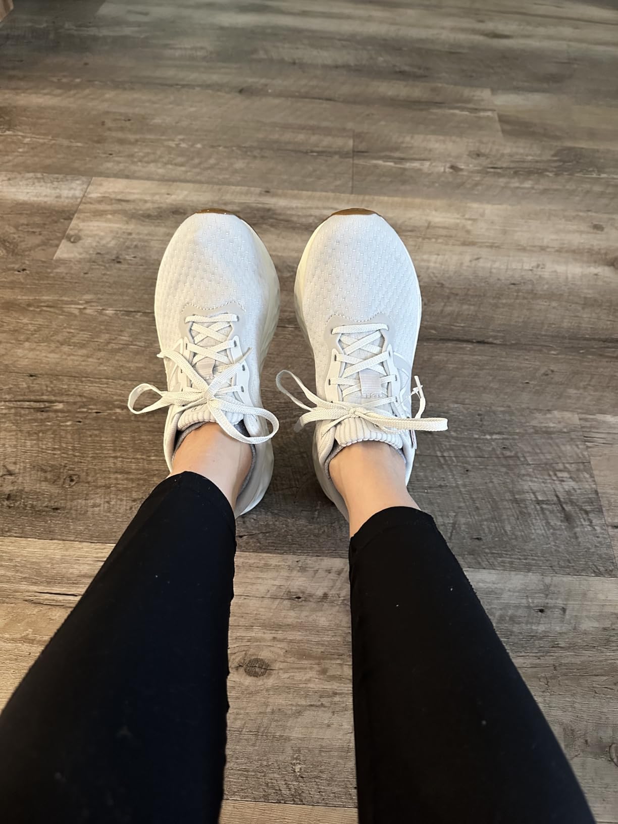Comparison showing New Balance Arishi V4 sizing and fit on feet
