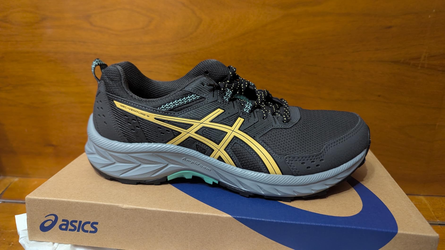 ASICS Men's Gel-Venture 9 running shoes showing mesh upper and trail outsole design