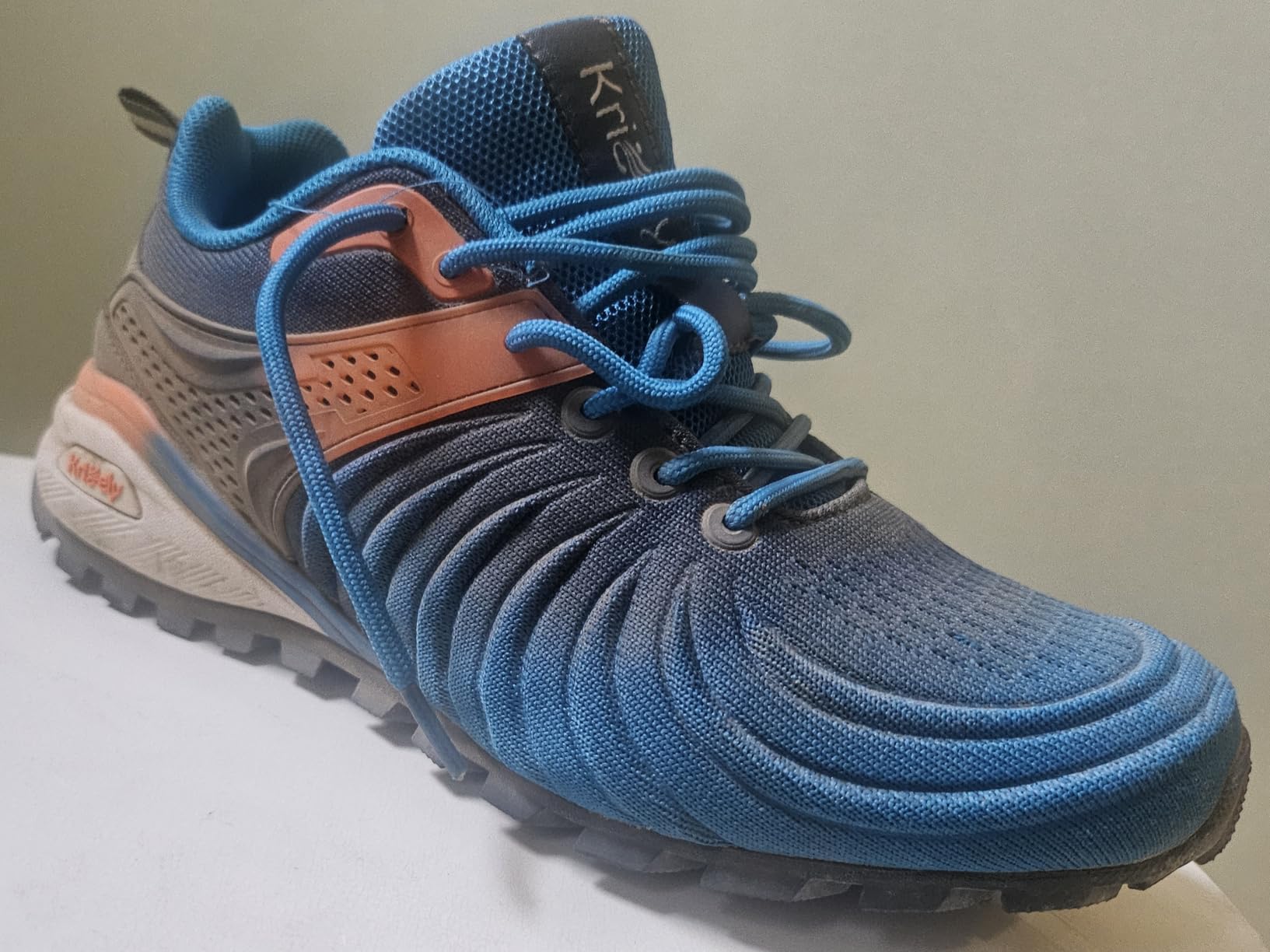 Close-up view of Kricely walking shoes showing breathable mesh upper construction and lacing system