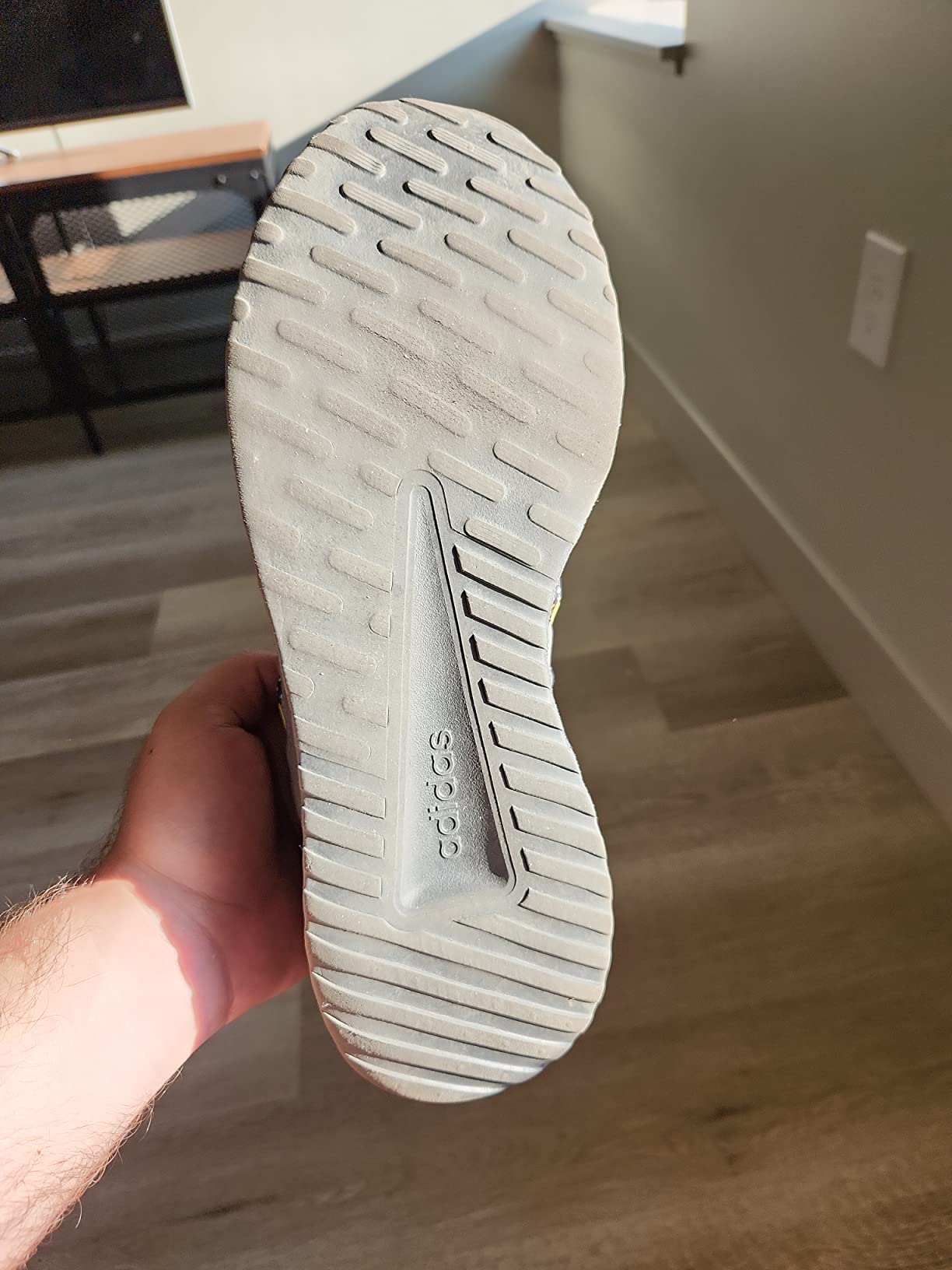 Sole wear after one month showing rapid degradation of tread pattern