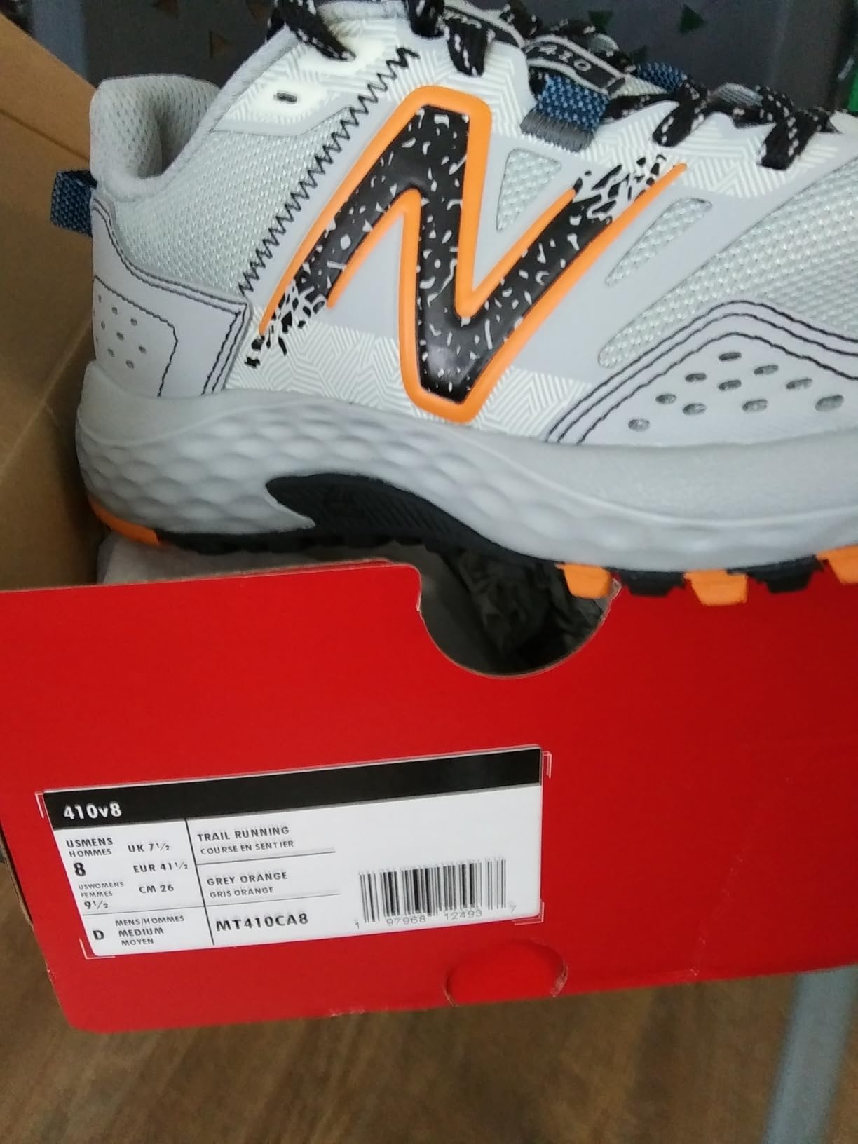 New Balance MT410V8 trail running shoe showing synthetic upper and AT Tread outsole design