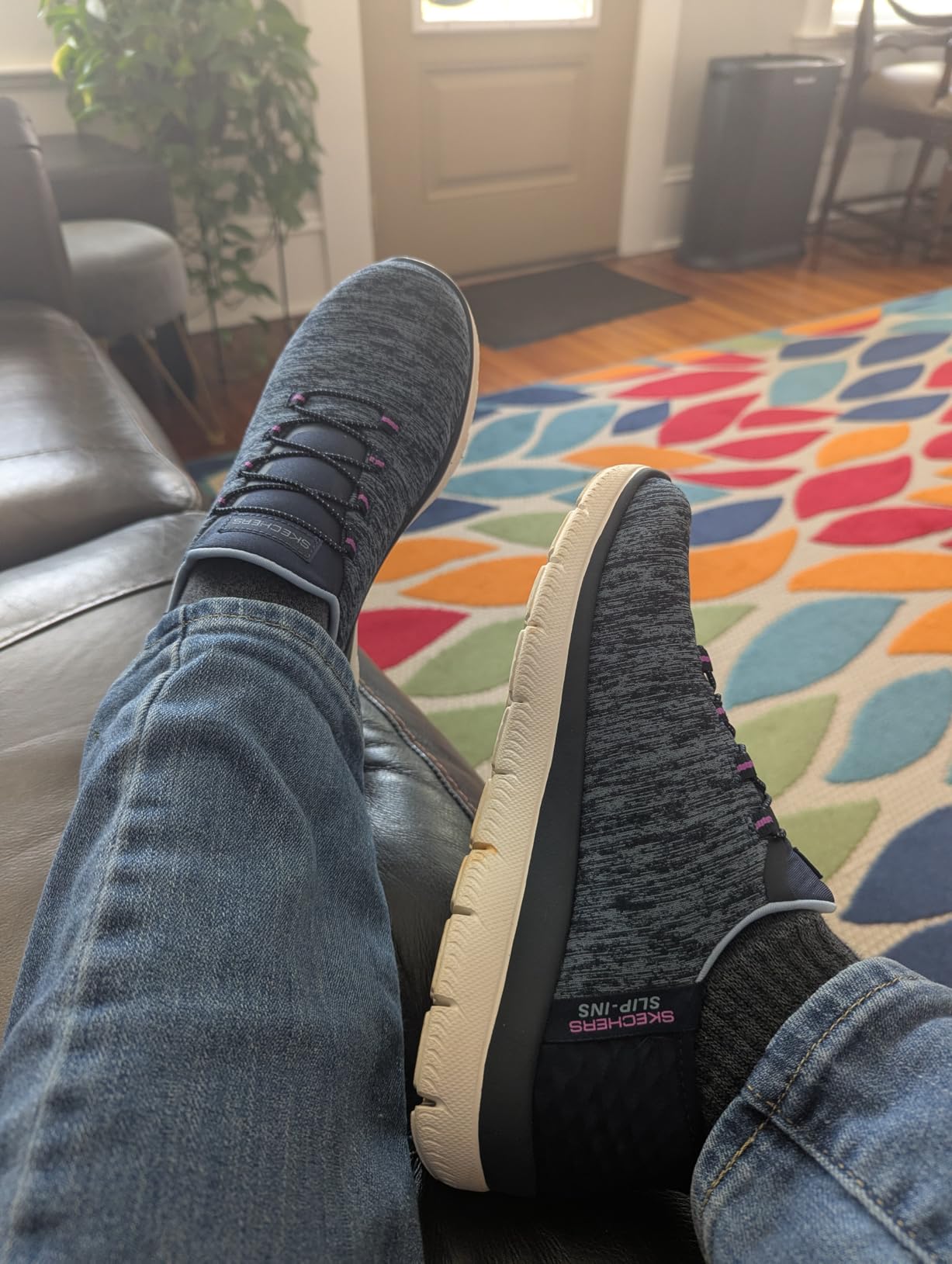 Side profile showing Skechers lightweight construction and shock-absorbing heel design
