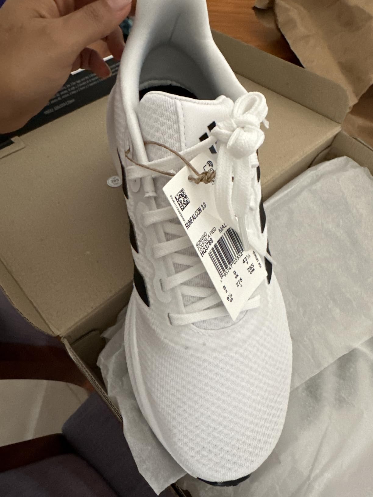 Close-up view of Adidas Run Falcon 3.0 showing textile mesh upper construction and classic 3-stripes design