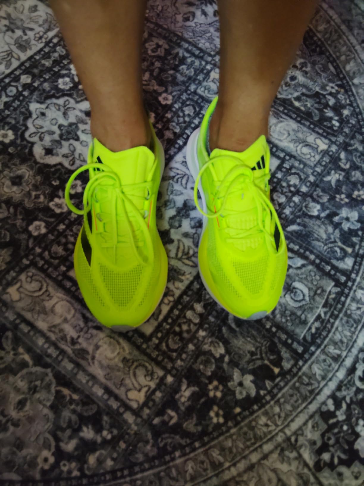 Close-up view of Adidas Runfalcon 3 showing textile upper construction and three stripes design