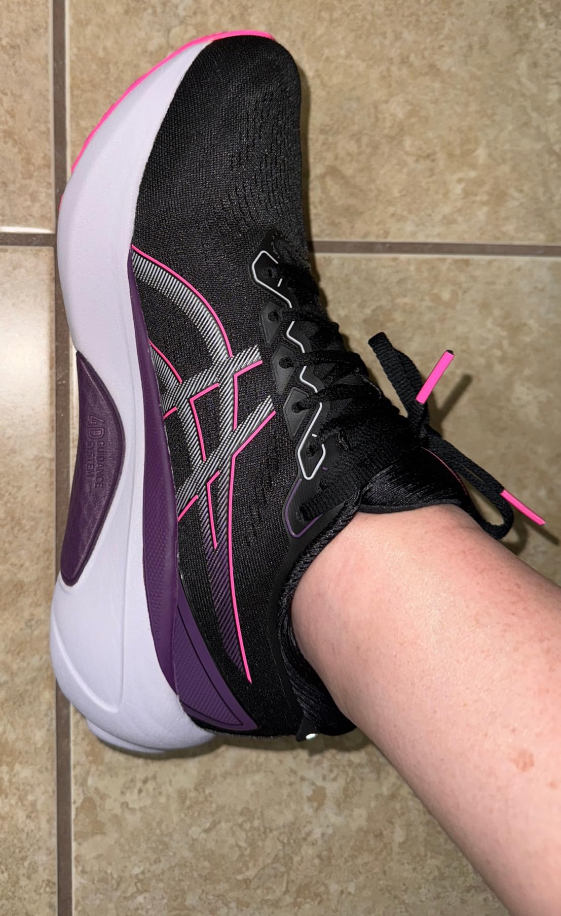 Close-up view of ASICS Gel-Kayano 30 engineered knit upper showing breathable mesh construction