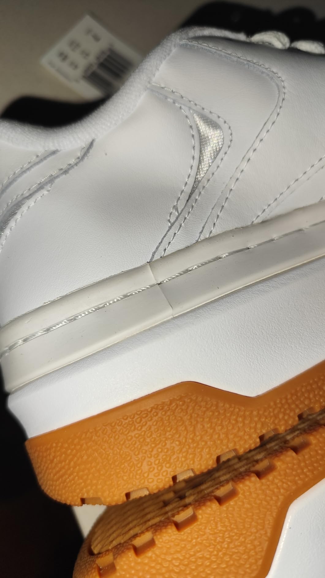 Close-up detail of Reebok Club C Extra showing leather upper construction and platform sole design