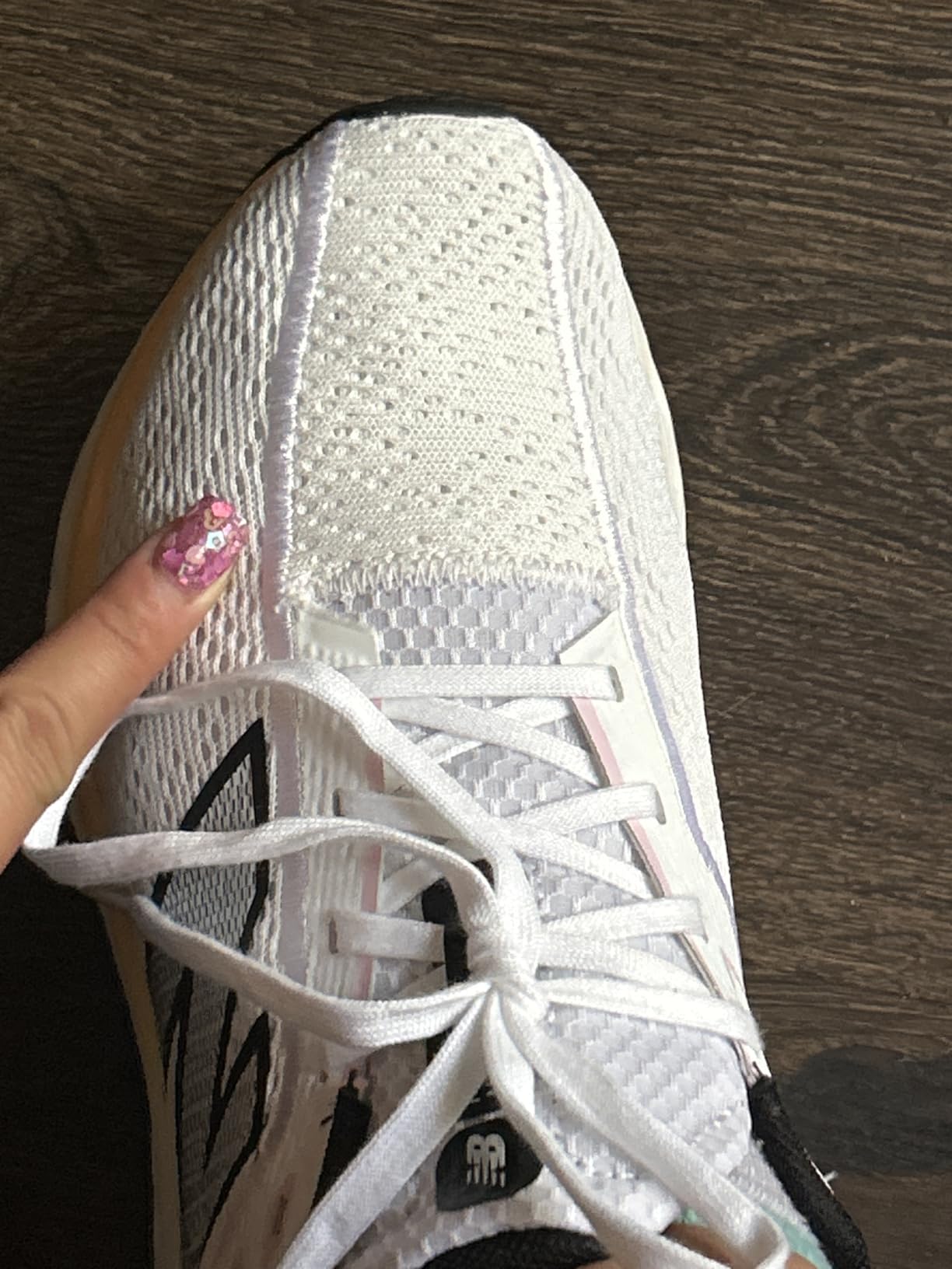 Close up detail of New Balance Fresh Foam Arishi V4 mesh upper construction and no-sew overlays