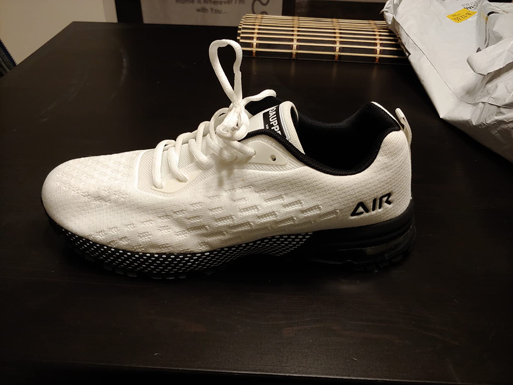 QAUPPE sneakers showing lightweight knit fabric upper construction and flexible design