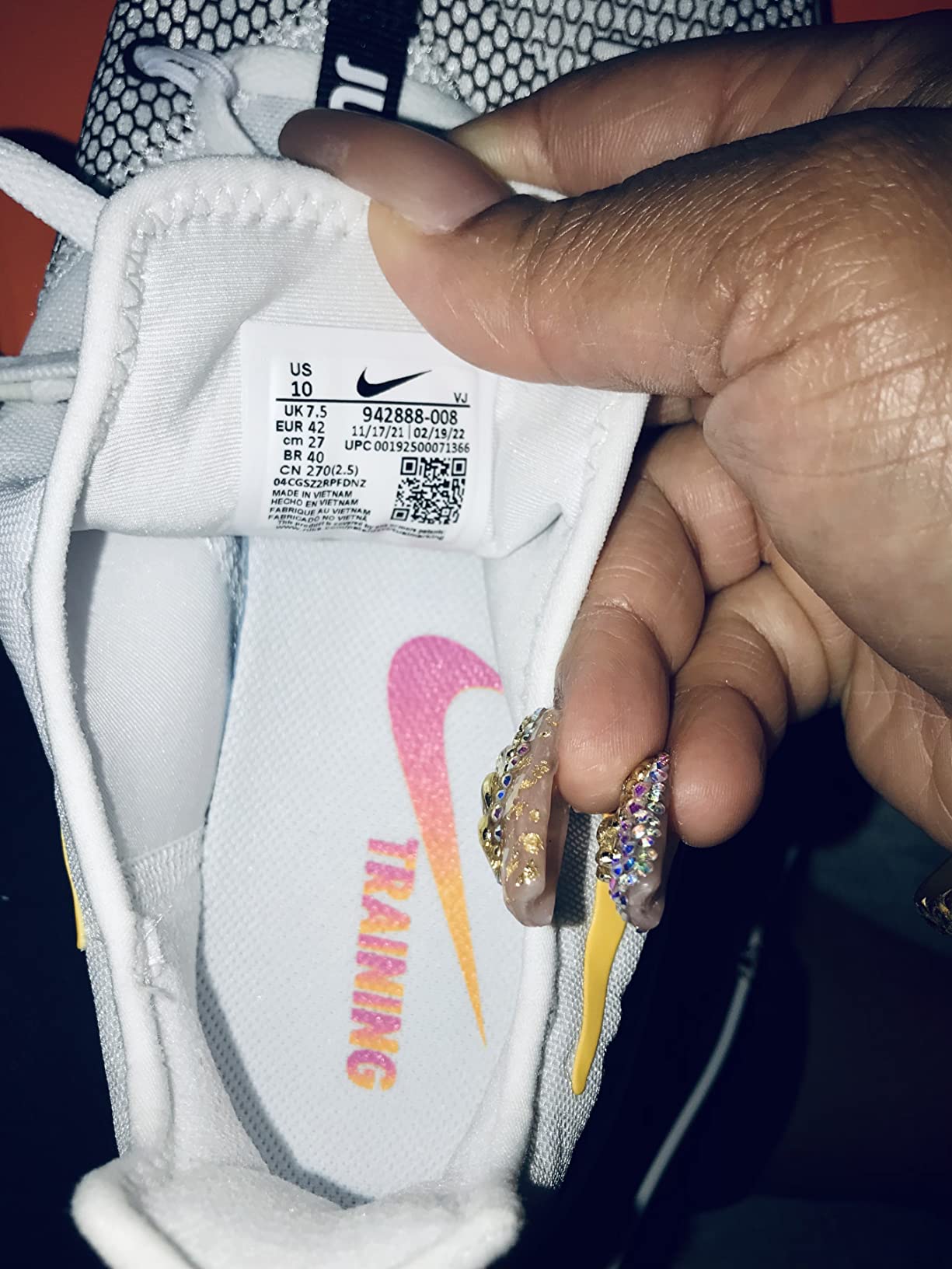 Detailed view of the Nike Women's training shoe outsole showing traction pattern and groove design