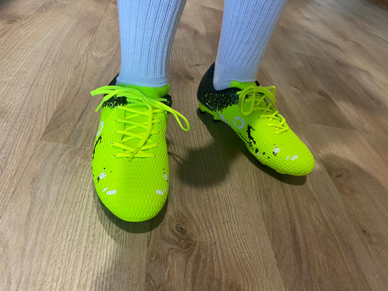 Multiple colorway options of LEOCI kids soccer cleats showing variety available for young players
