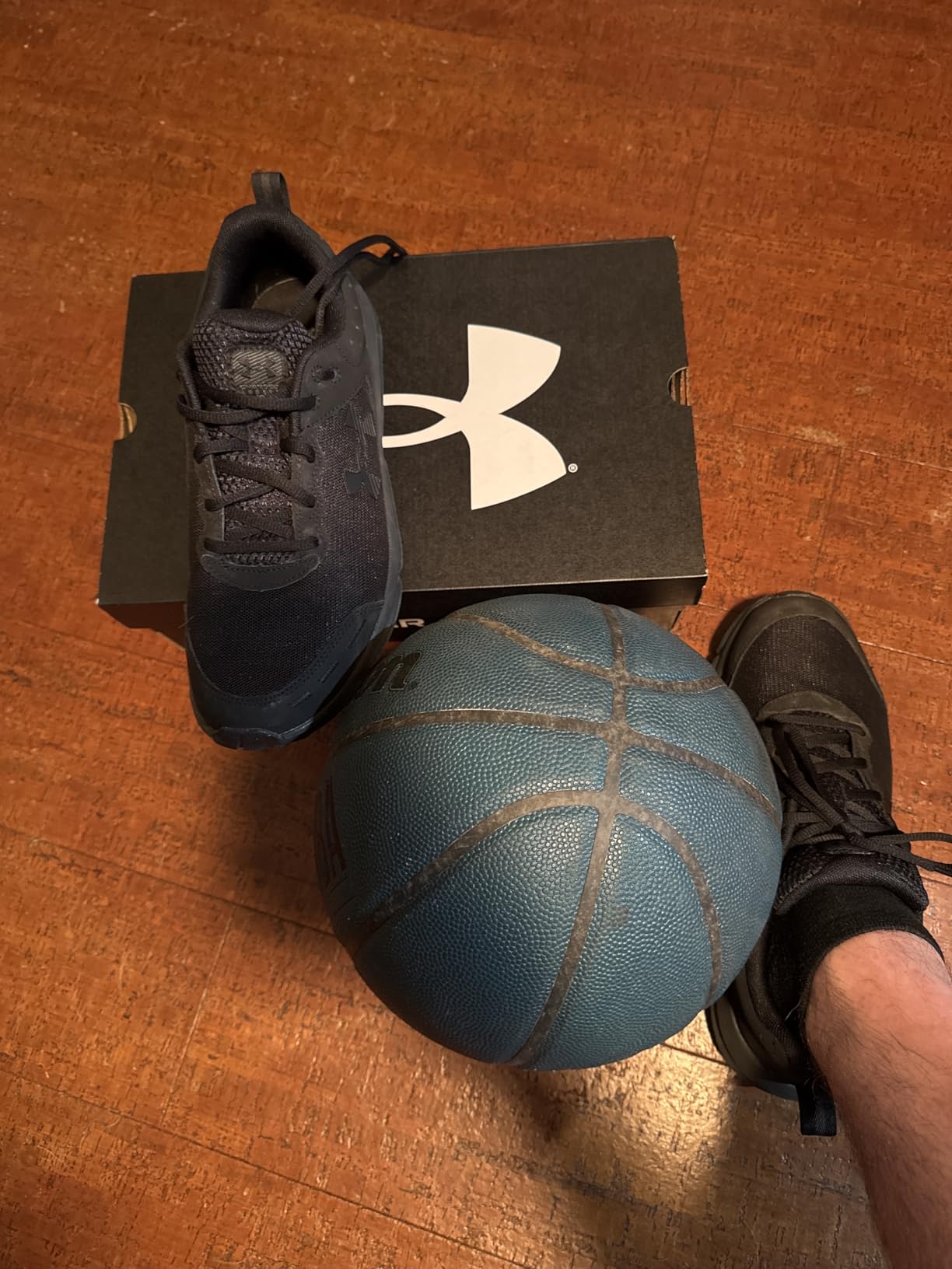Under Armour Mens Charged Assert 10 running shoe main product view showing mesh upper and rubber outsole