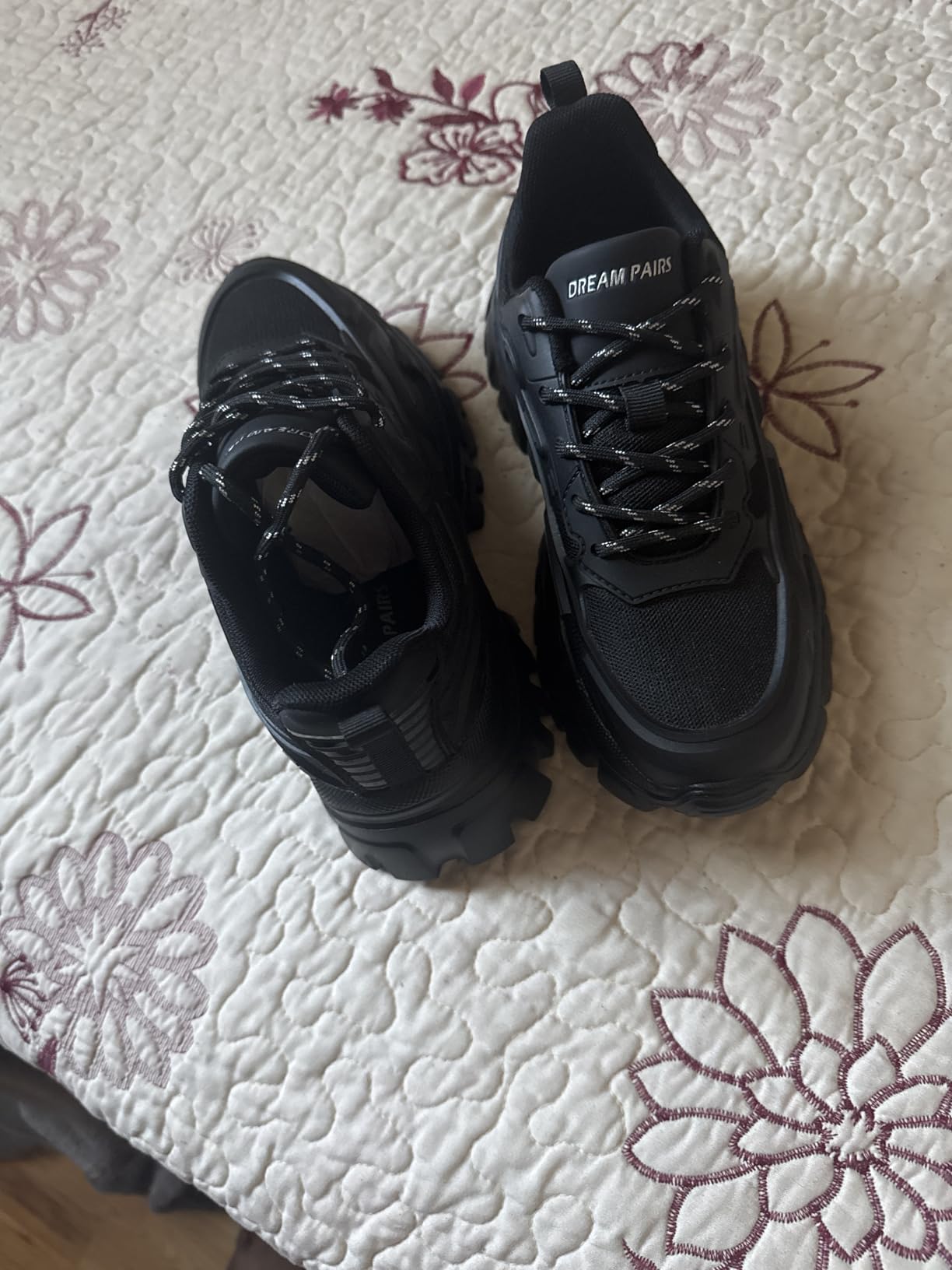 Bottom sole view showing textured tread pattern and lightweight MD construction