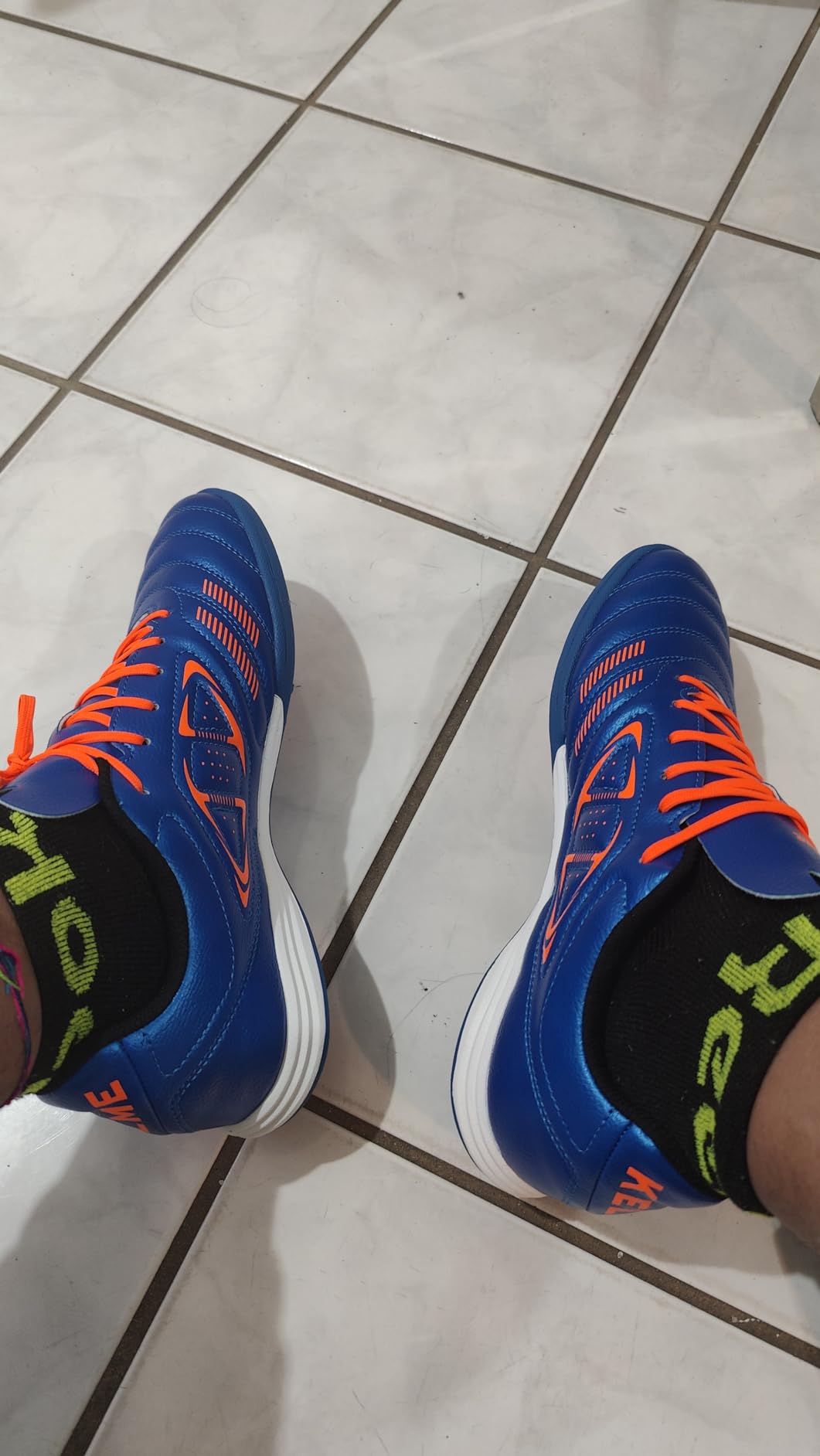 KELME turf shoes showing length comparison and toe box spacing issues with sizing