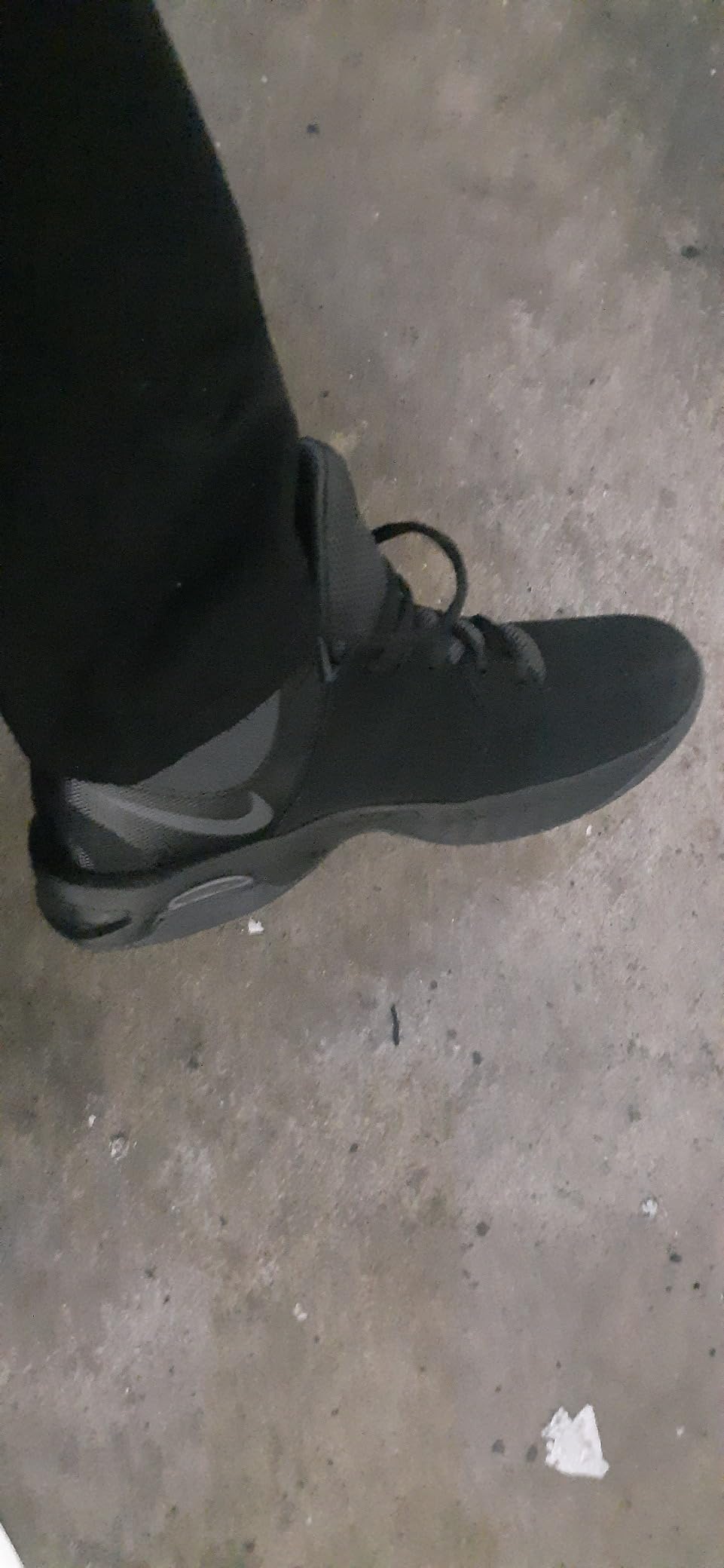 Nike Court Royale side profile showing leather construction and foam padded collar design