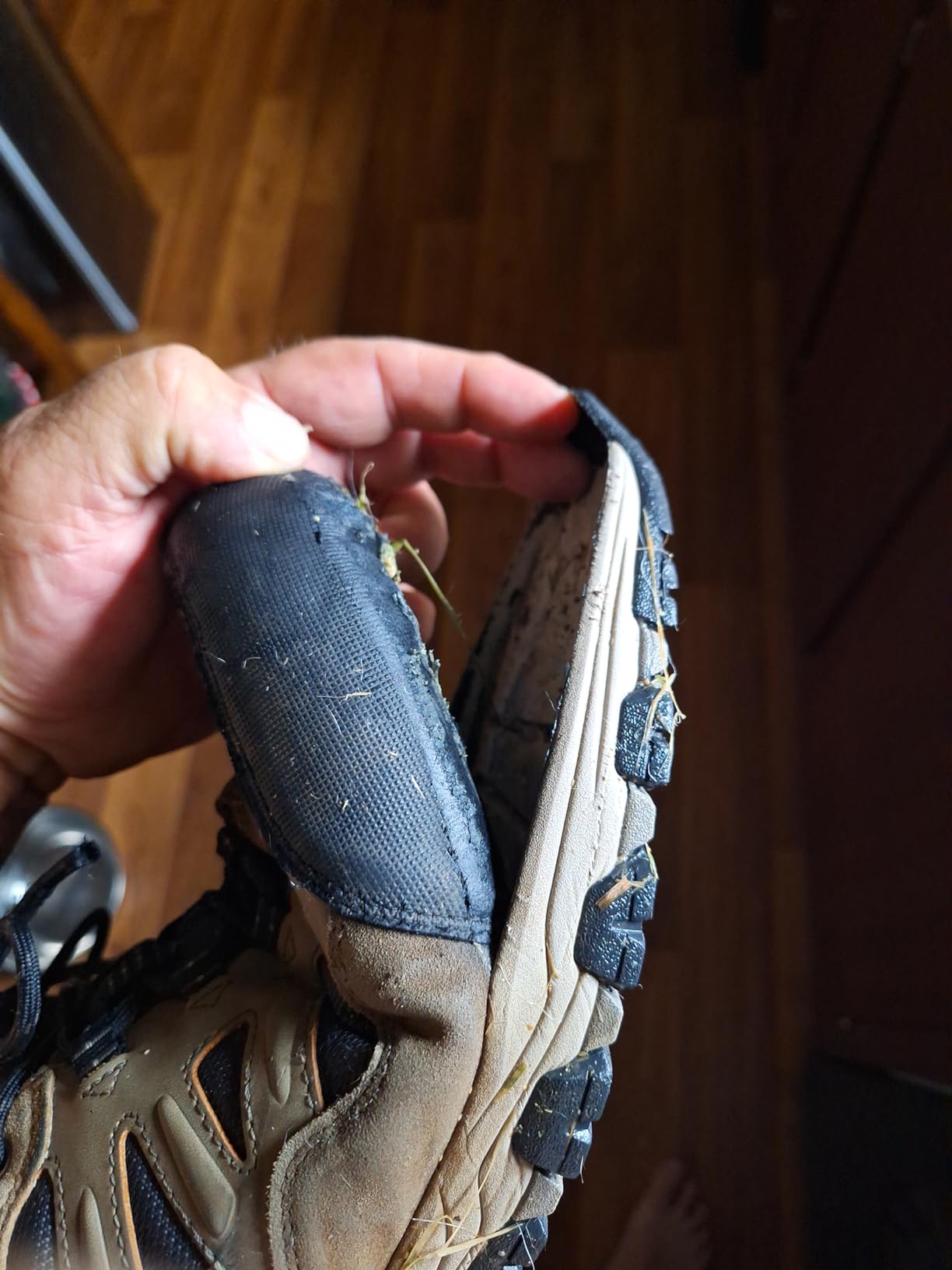 Skechers hiking shoe showing water damage and sole separation after moderate outdoor use