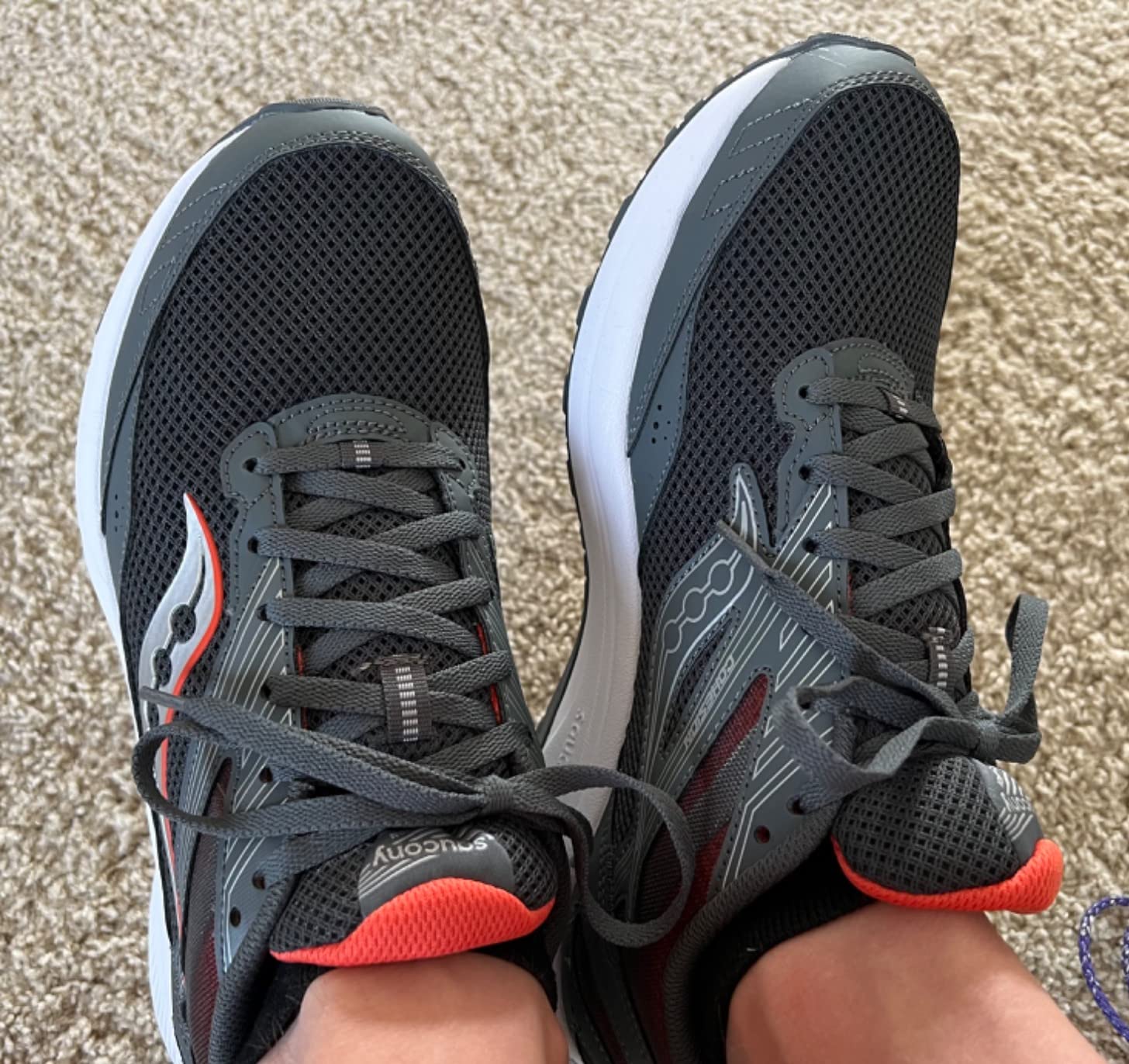 Saucony Men's Cohesion 15 running shoe grey colorway showing VERSARUN cushioning technology