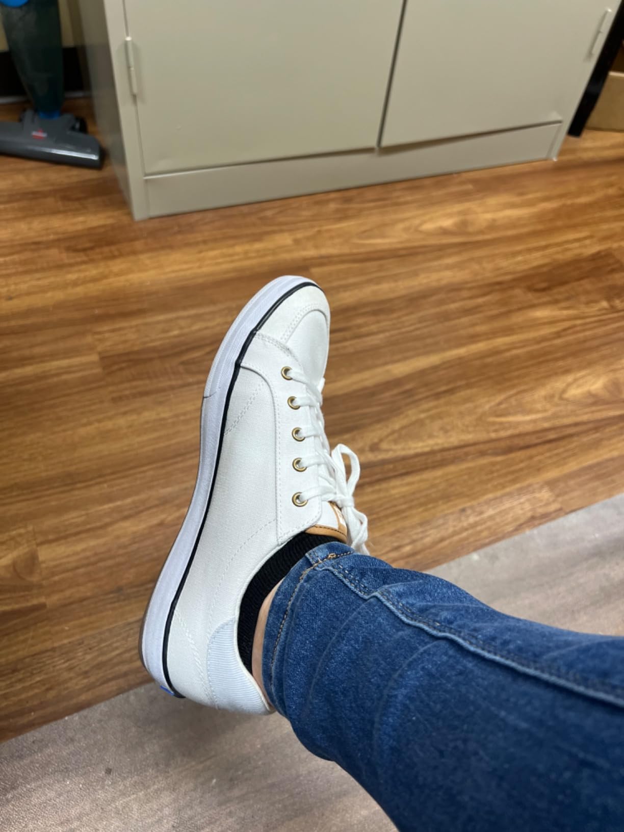 Keds sneakers lifestyle shot showing versatile styling with casual outfit