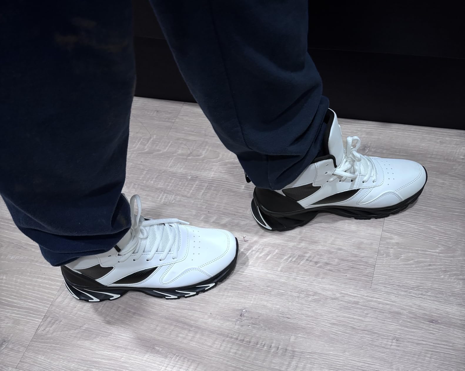 Joomra high top sneaker side profile showing lace-up design and ankle height construction