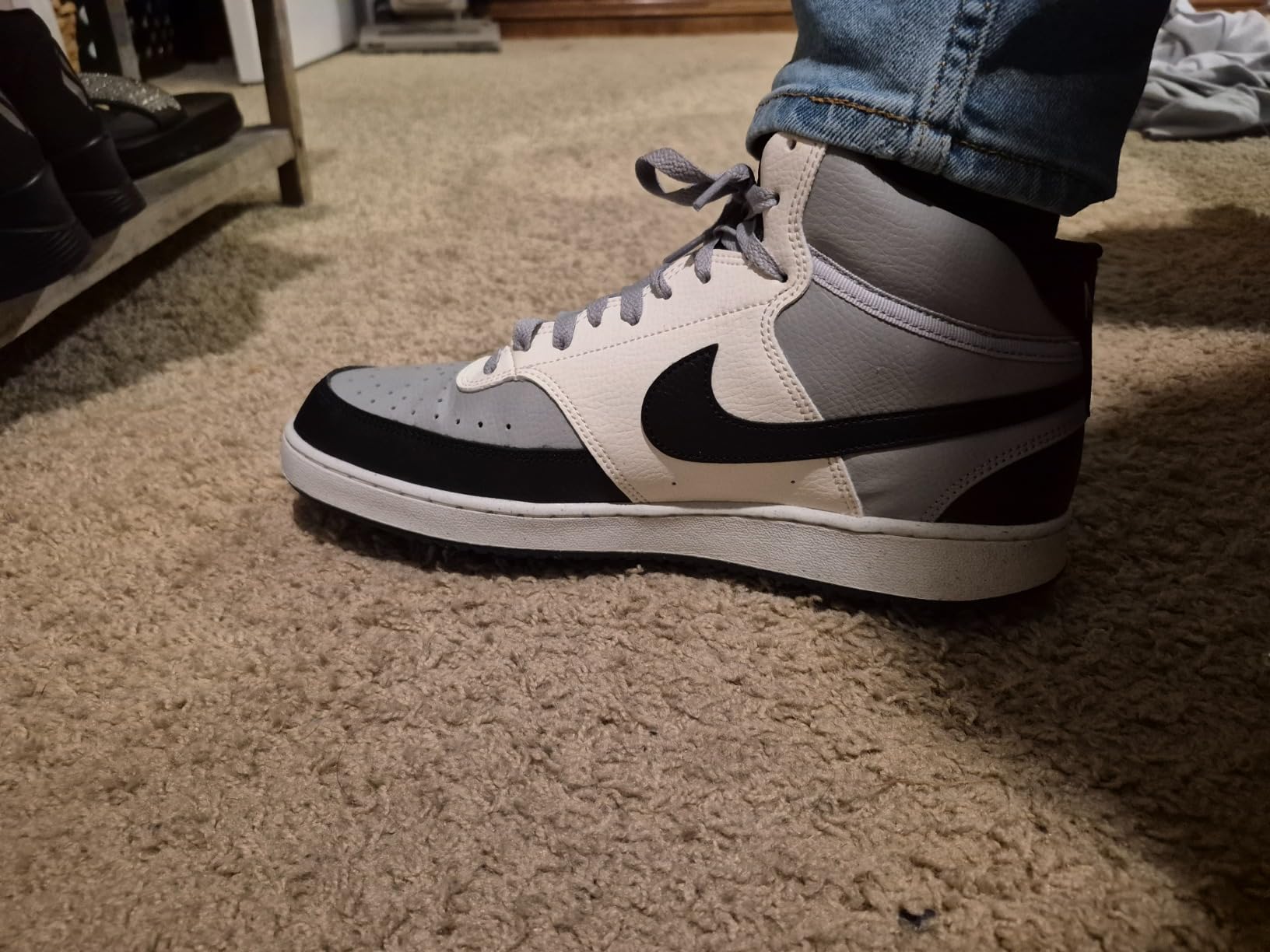 Nike Court Vision Mid side profile showing mid-top silhouette and synthetic leather construction