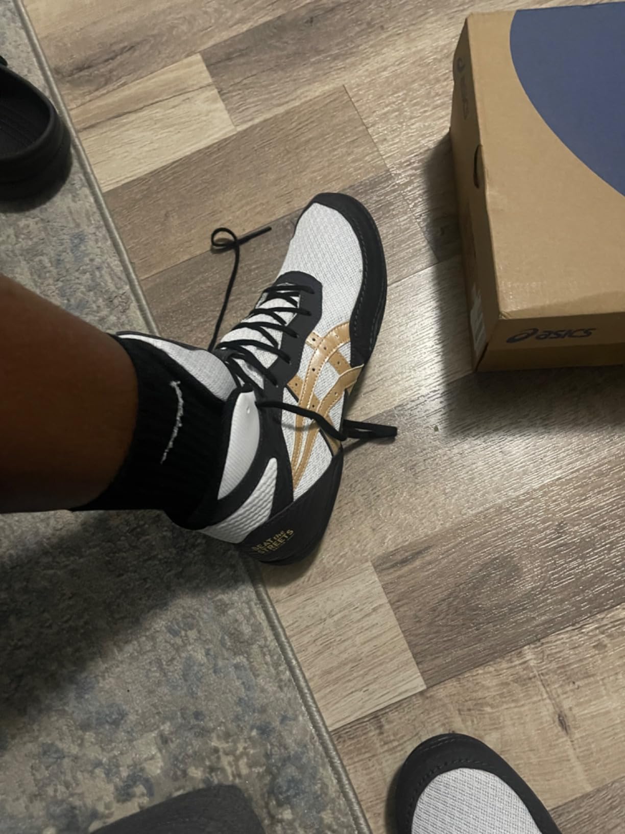ASICS Matflex 7 wrestling shoes in action during wrestling practice showing mat grip performance
