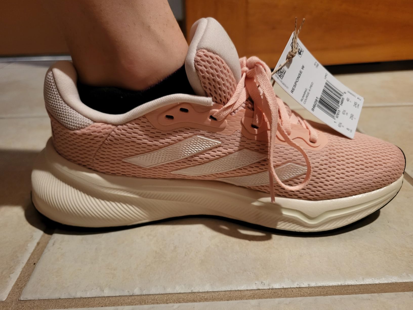 Close up view of Adidas Women's Response shoe mesh upper and lacing system design