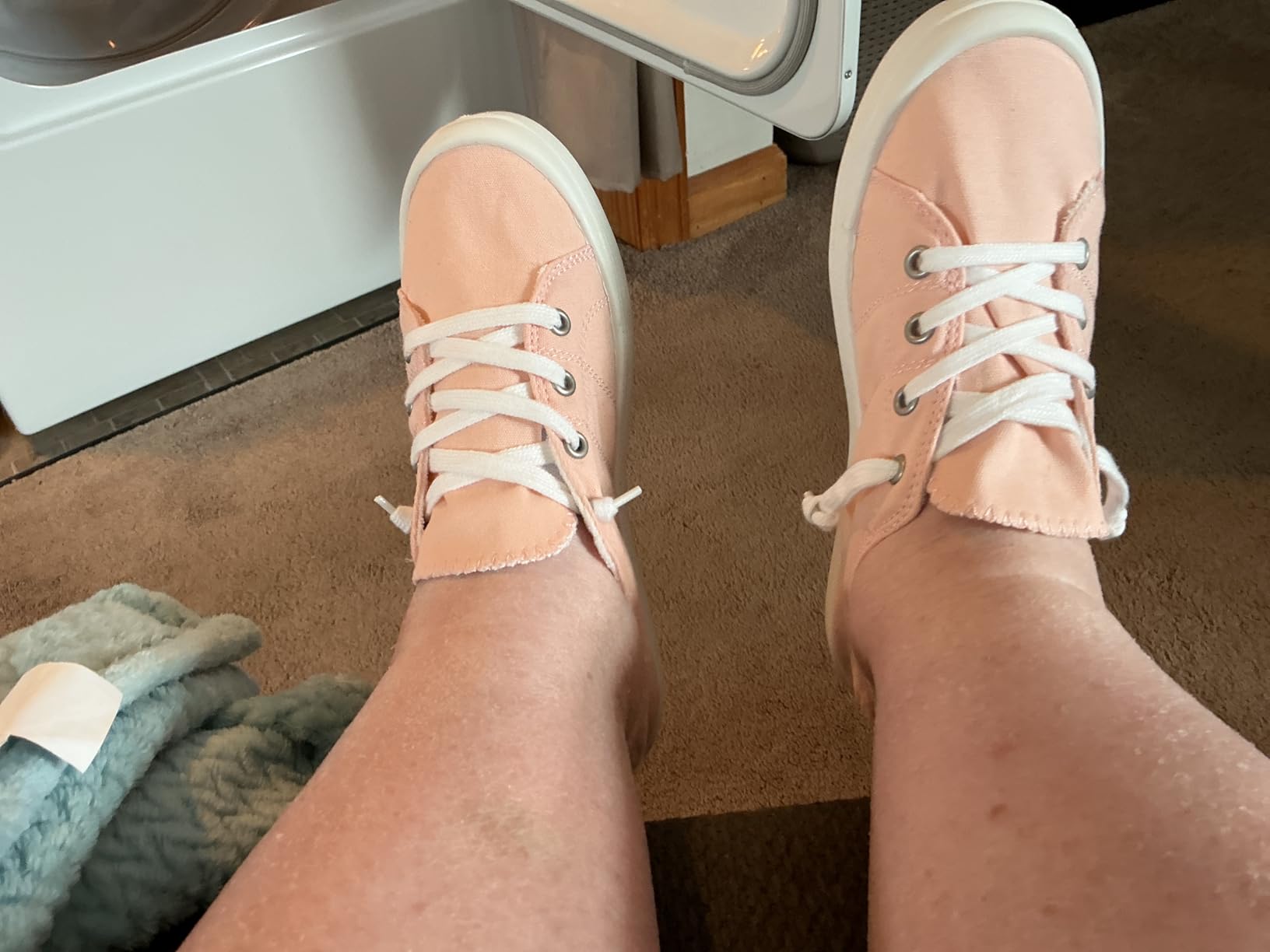 Pink canvas slip-on sneakers showing elastic lace design and canvas upper construction