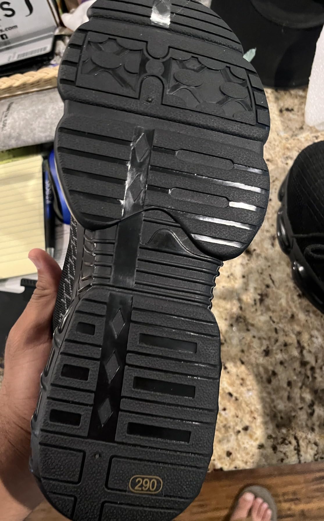 Work shoes being tested on construction site showing durability and grip performance
