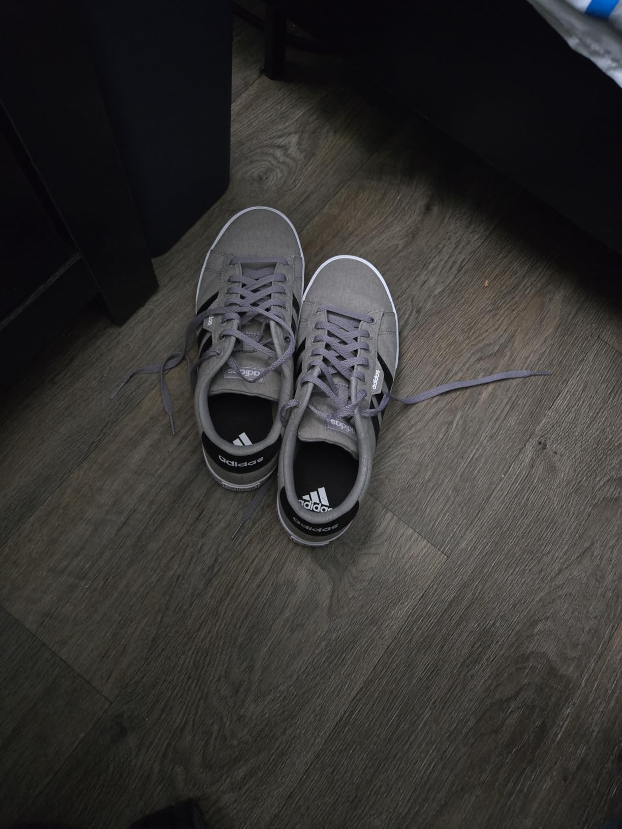 Adidas Daily 3.0 side profile showing classic three stripes design and vulcanized rubber sole